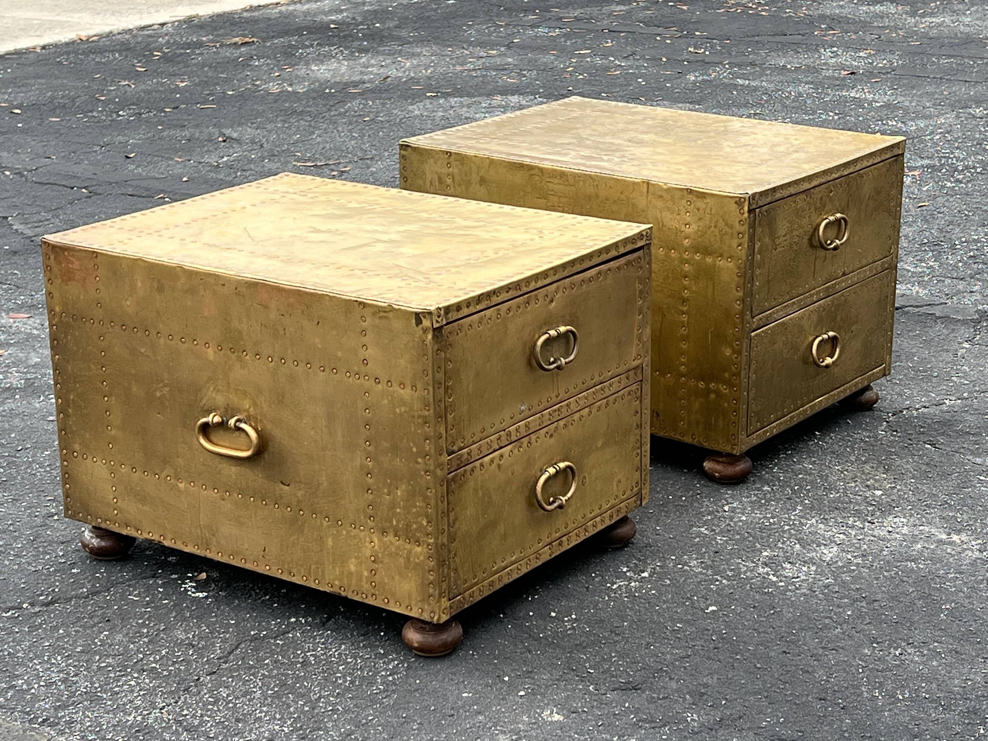 Rare to find a matched pair of small, two-drawer chests by Sarreid LTD. Patinated brass with a beautiful patina, campaign style handles on the sides for easier transport. Both signed in the drawer. These are very heavy, approximately 70-80 lbs each.