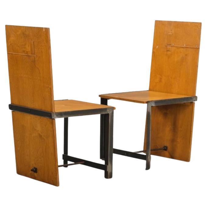 A pair of studio made plywood and iron chairs. These beautiful chair were a studio made  prototype. There is a sculptural element to these chairs that would enhance any room and turn them into the focal point as well as great conversation pieces.
