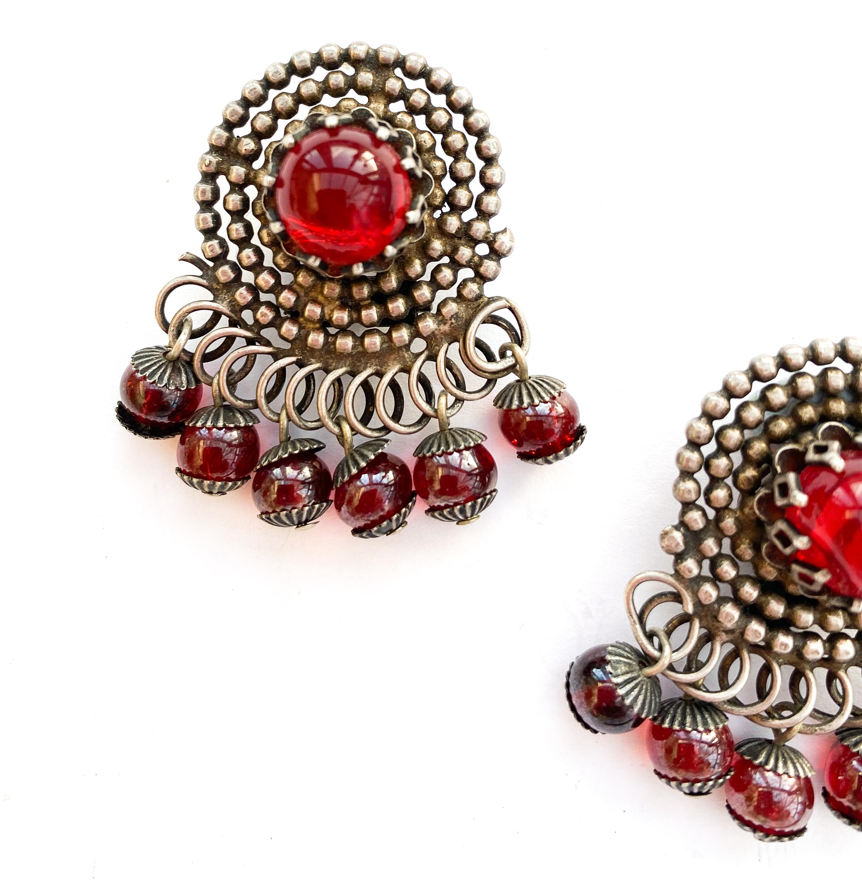Women's A pair of stylised silvered metal and red glass 'swirl' earrings, France, 1950s For Sale