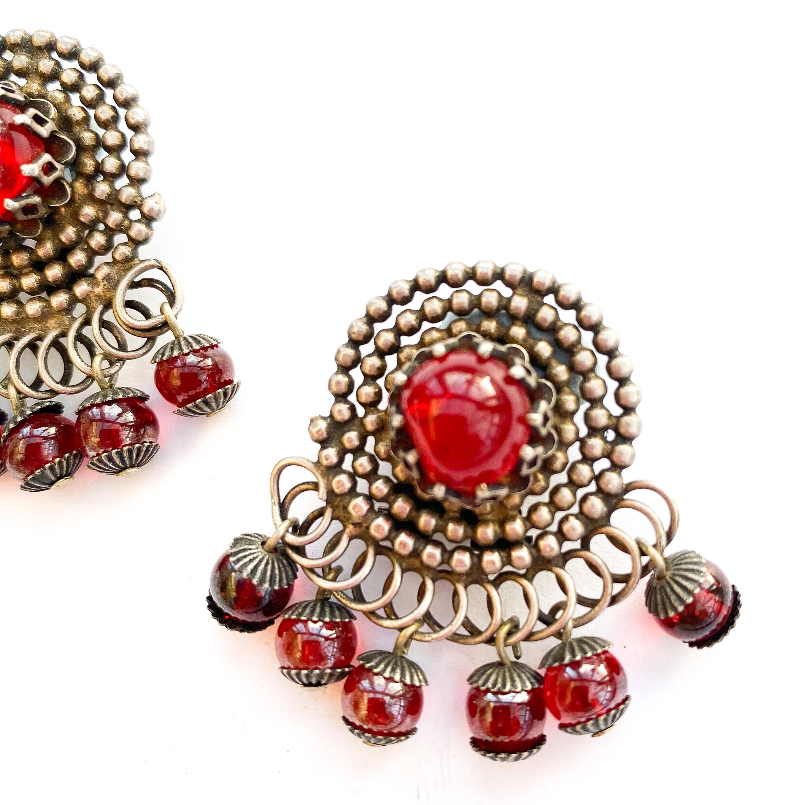 A pair of stylised silvered metal and red glass 'swirl' earrings, France, 1950s For Sale 1