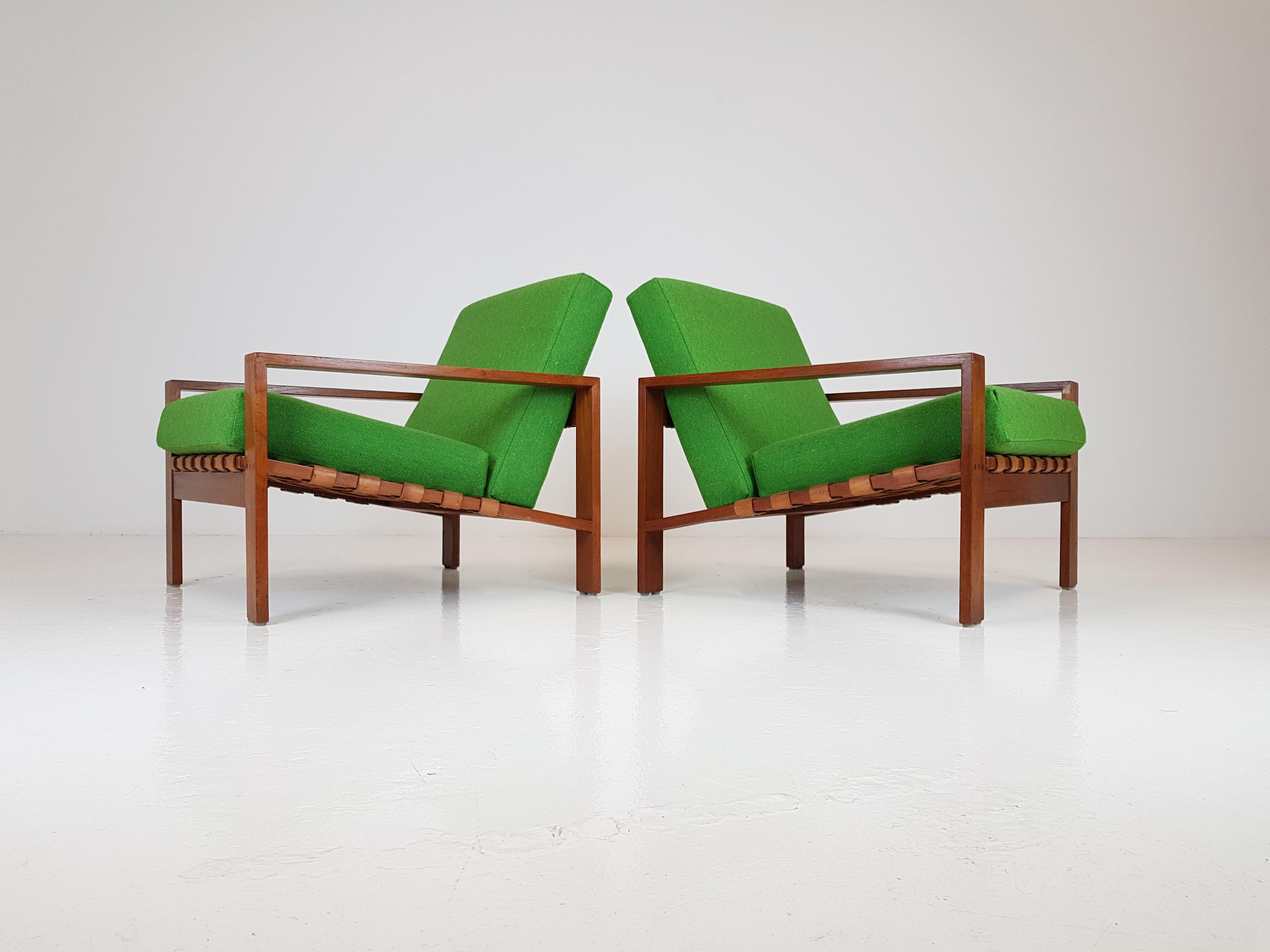 A stunning pair of Svante Skogh armchairs, produced in Sweden in the 1960s.

With the original leather webbing, cubical frames restored and reupholstered in a very close match to the original using Bute fabrics.

 