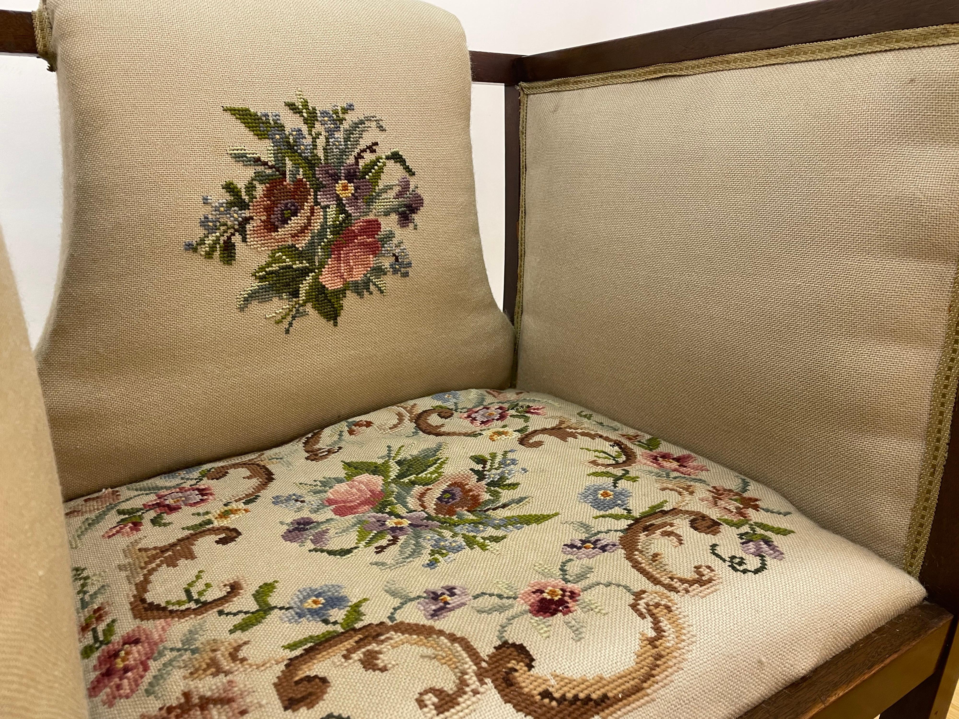 Such lovely chairs can hold their own in any setting! These solid walnut-stained birch chairs appear delicate due to the hand embroidered upholstery, but they are solid and strong. The original upholstery has aged to an ecru-tone, yet are in