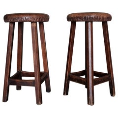 A pair of Swedish 1930-40s workshop stools in solid pine, original leather seats A pair of Swedish 1930-40s workshop stools in solid pine, original leather seats
