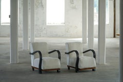 A Pair of Swedish Art Deco Lounge Chairs with Curved Armrests, 1930s