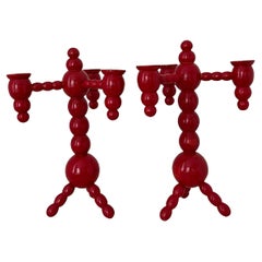 A pair of Swedish Christmas candelabras red painted wood bobbin 1970s