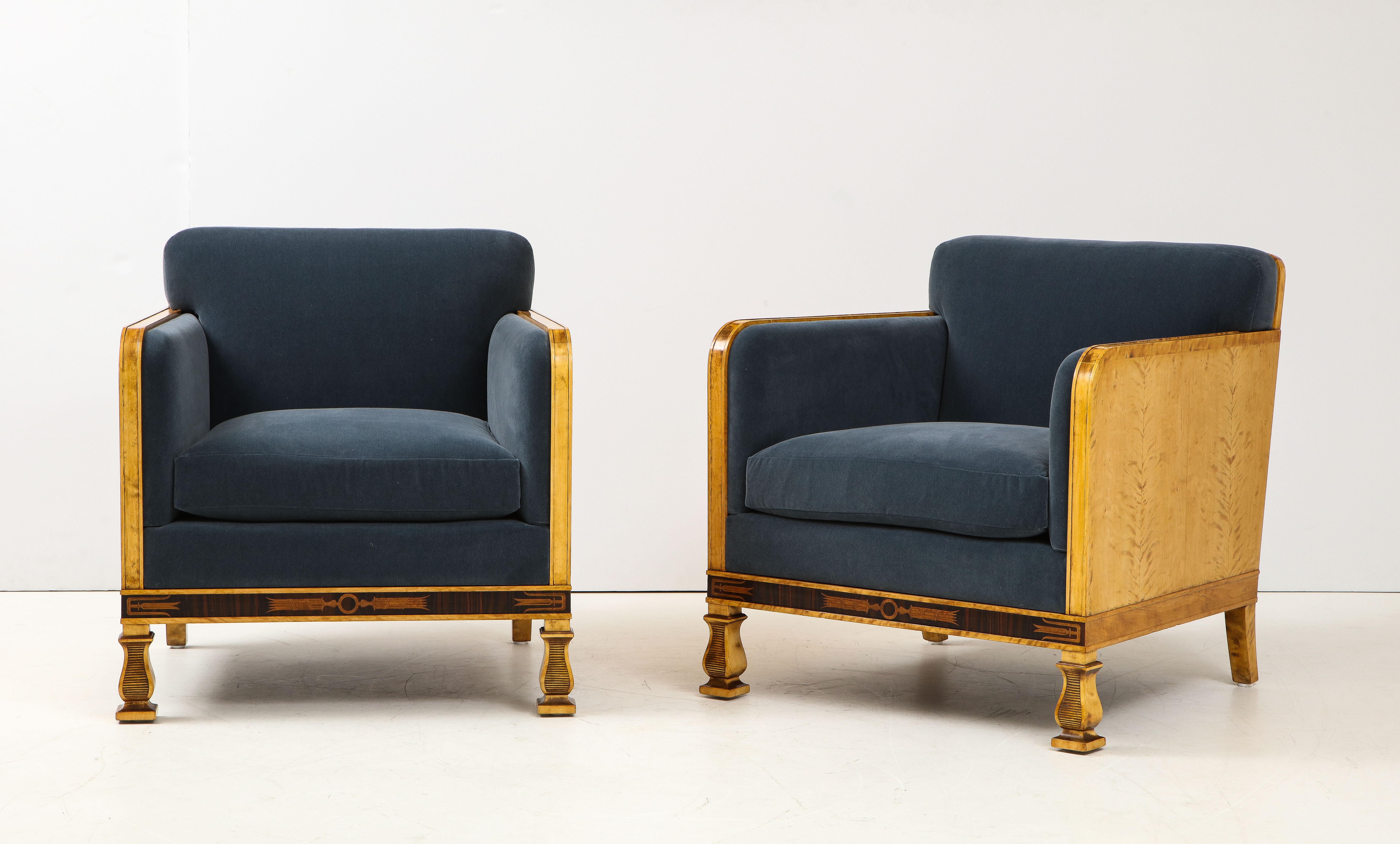 A rare pair of Swedish Grace armchairs, Svenska Möbelfabrikerna Bodafors, 1920s-30s, probably designed by Carl Malmsten, with a rich figured birchwood frame and classical Swedish Grace inlay work. Stamped on the base. New velvet upholstery.