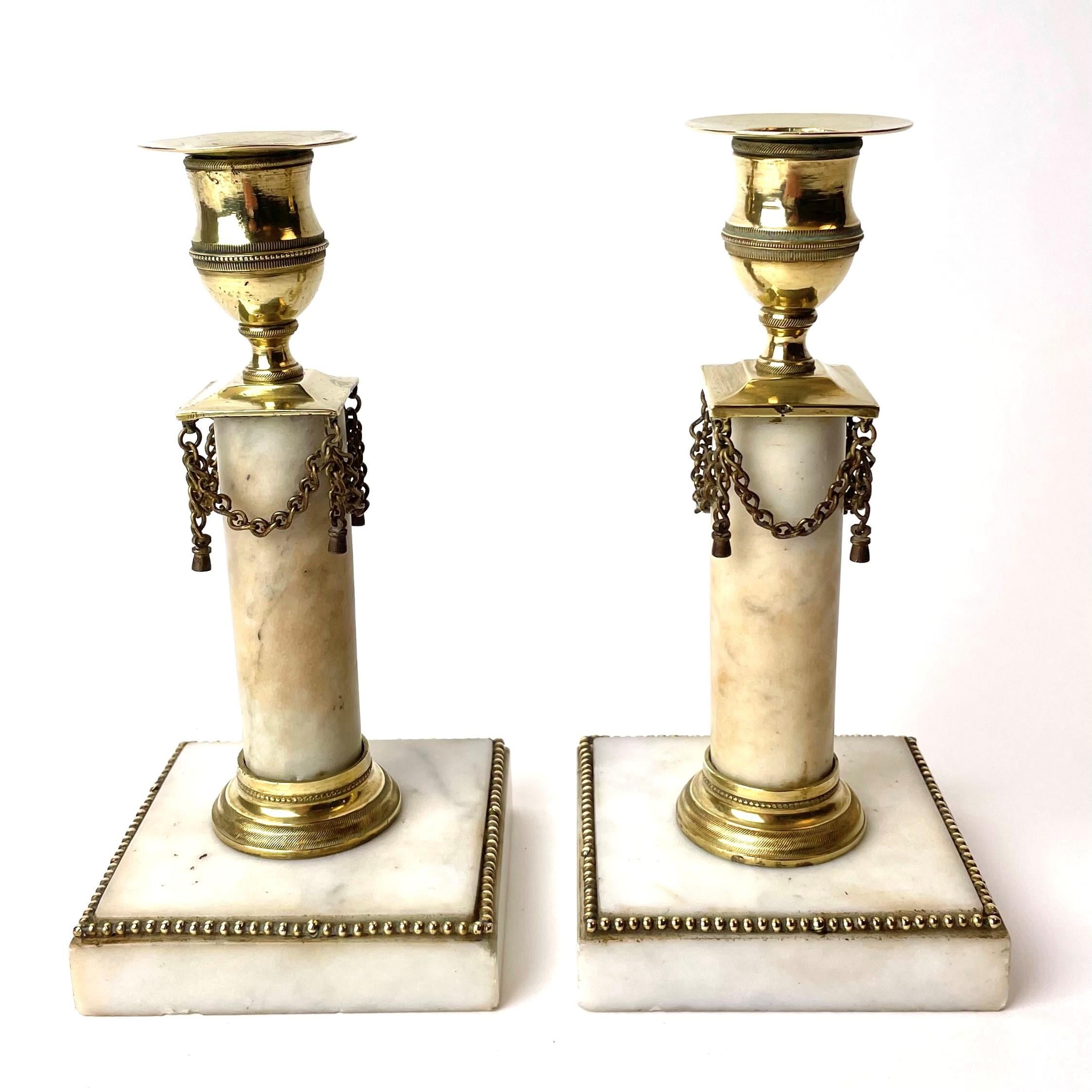 A pair of Swedish Gustavian candlesticks with beautiful patina. Probably made in Stockholm during the 1780s-1790s.

The candlesticks have minor marks, chips and discolorations (see pictures), but for their age they are in good condition with a