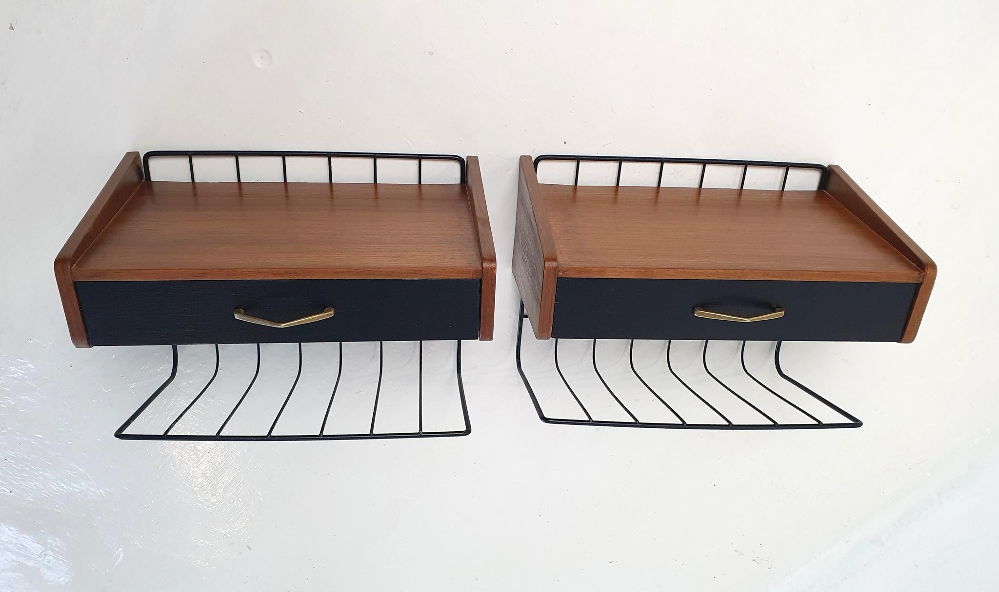 A pair of mid century modern nightstands handmade in Sweden during the 1950's. The nightstands have been recently professionally restored giving the wood it's original shine reflecting the grain in the wood. Complete with drawer and a holder for