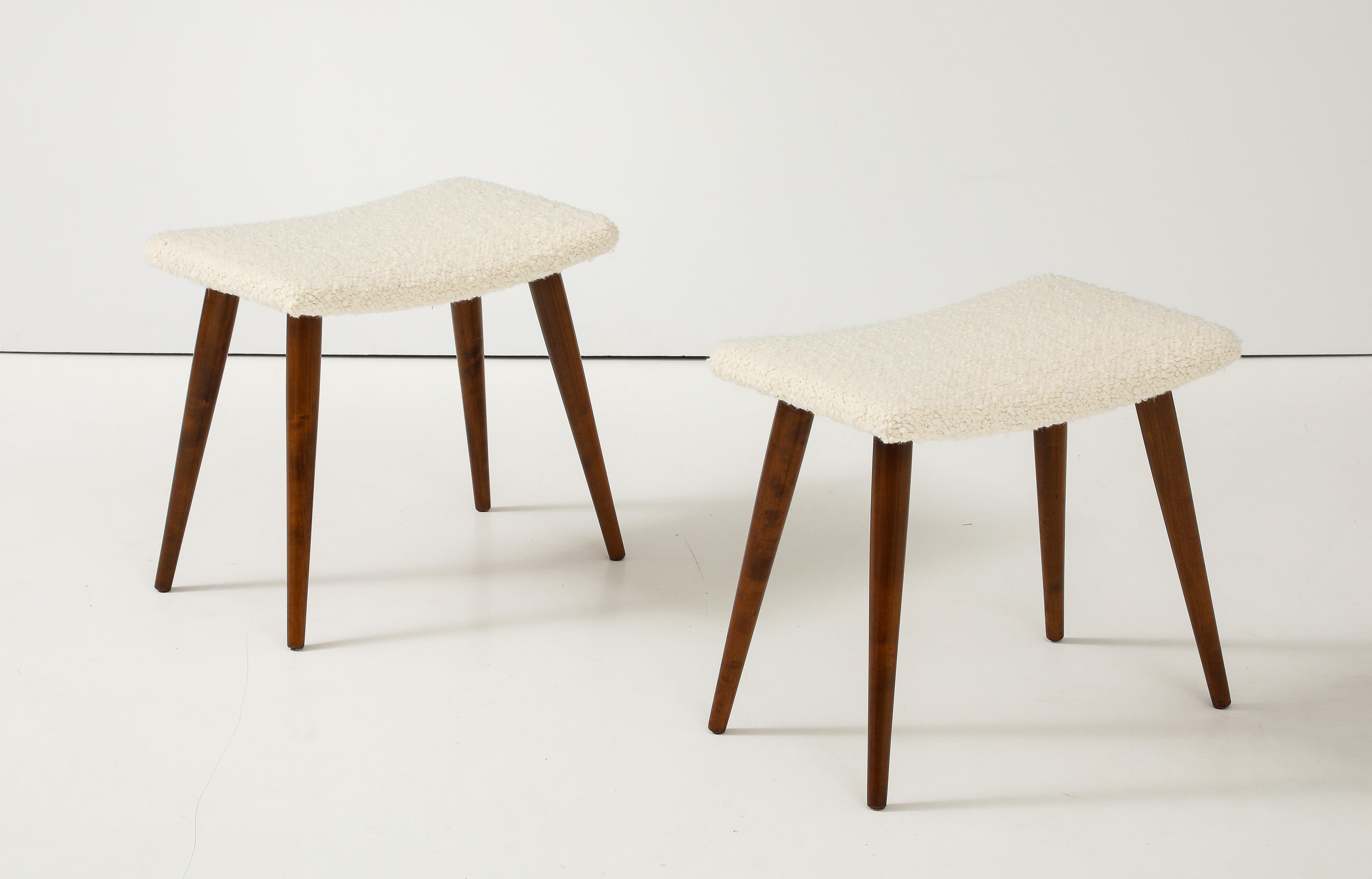 A pair of Swedish stools, Circa 1960s, each with an upholstered seat above solid birch turned legs.