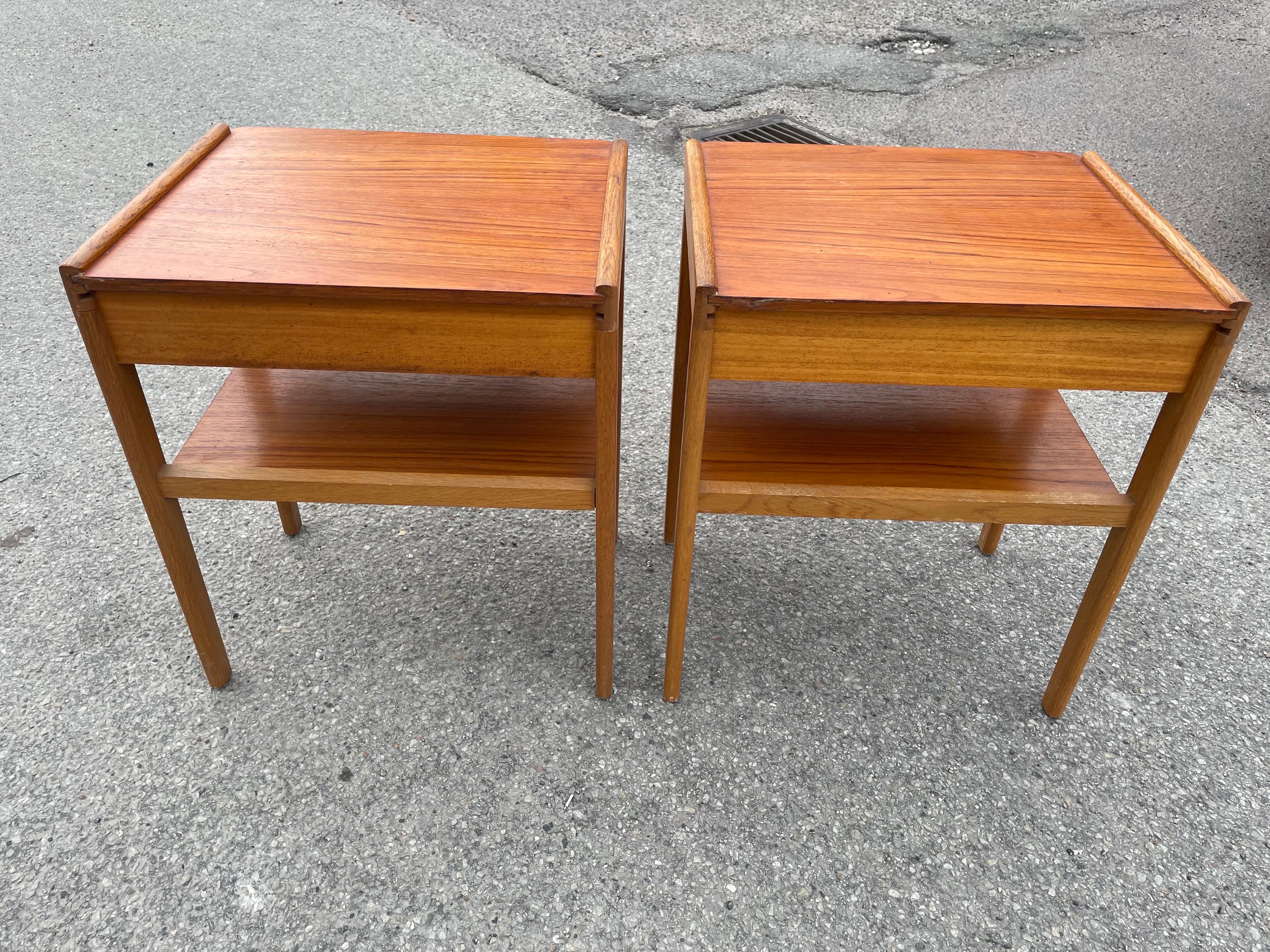 An exquisite pair of Swedish teak and oak nightstands by the renowned Ahlqvist brothers from Skåne, Värsjö. These pieces showcase the refined craftsmanship and natural beauty of Scandinavian design, offering both elegance and generous storage. With