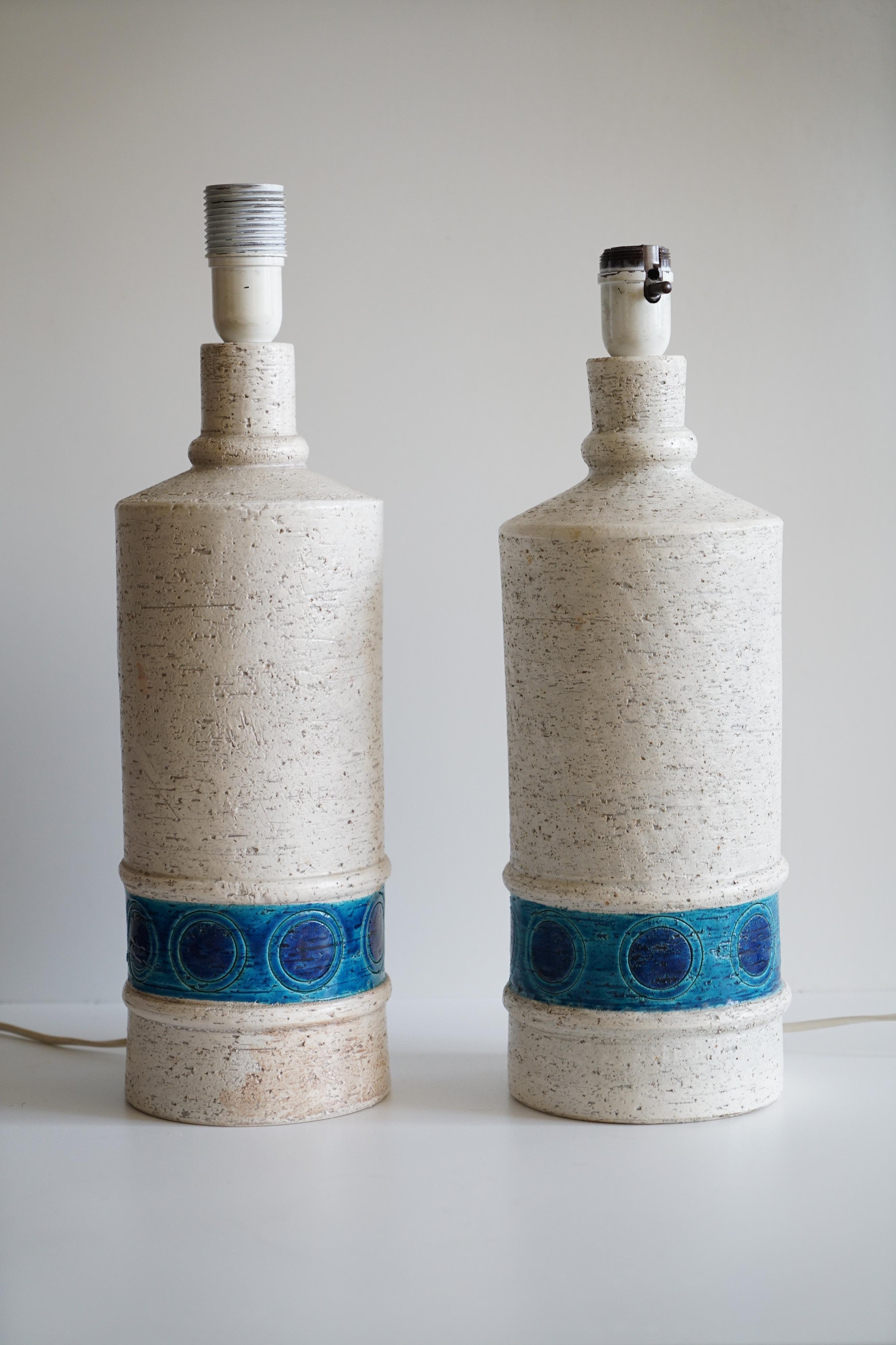 A pair of table lamps by Bitossi for Bergboms, Italy/Sweden, circa 1960s. Textured ceramic with glossy  details. Marked and numbered by manufacturer. Existing wiring, rewiring available upon request.
