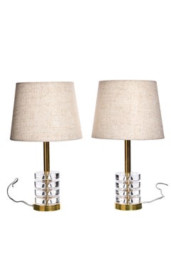 A pair of table lamps by Carl Fagerlund for Orrefors, glass and brass, 1960s