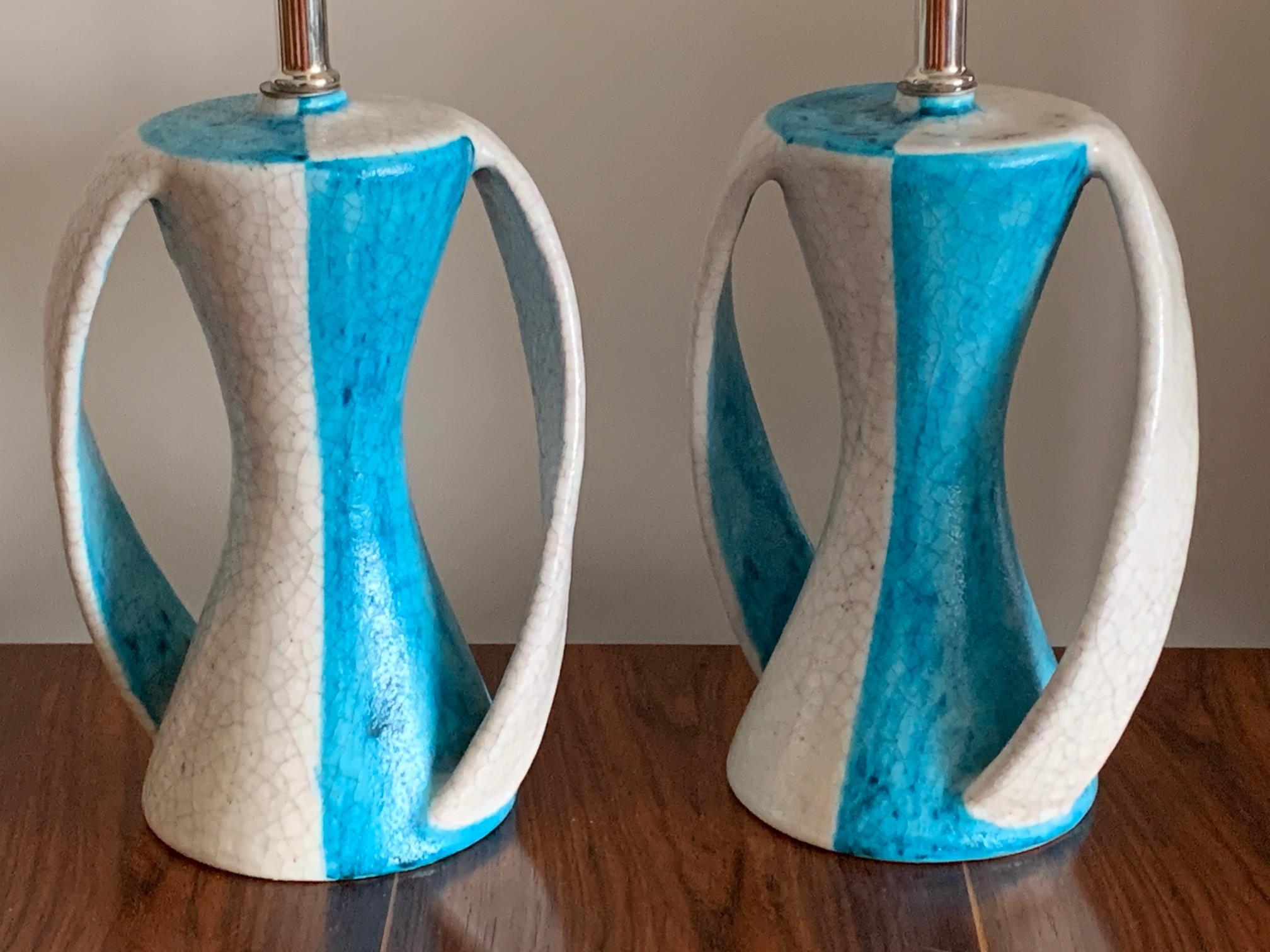 A great pair of ceramic lamps by Guido Gambone (1909-1969), one of Italy's most influential 20th Century potters. Signed with a Donkey mark. Ceramic bases alone measure approx. 9