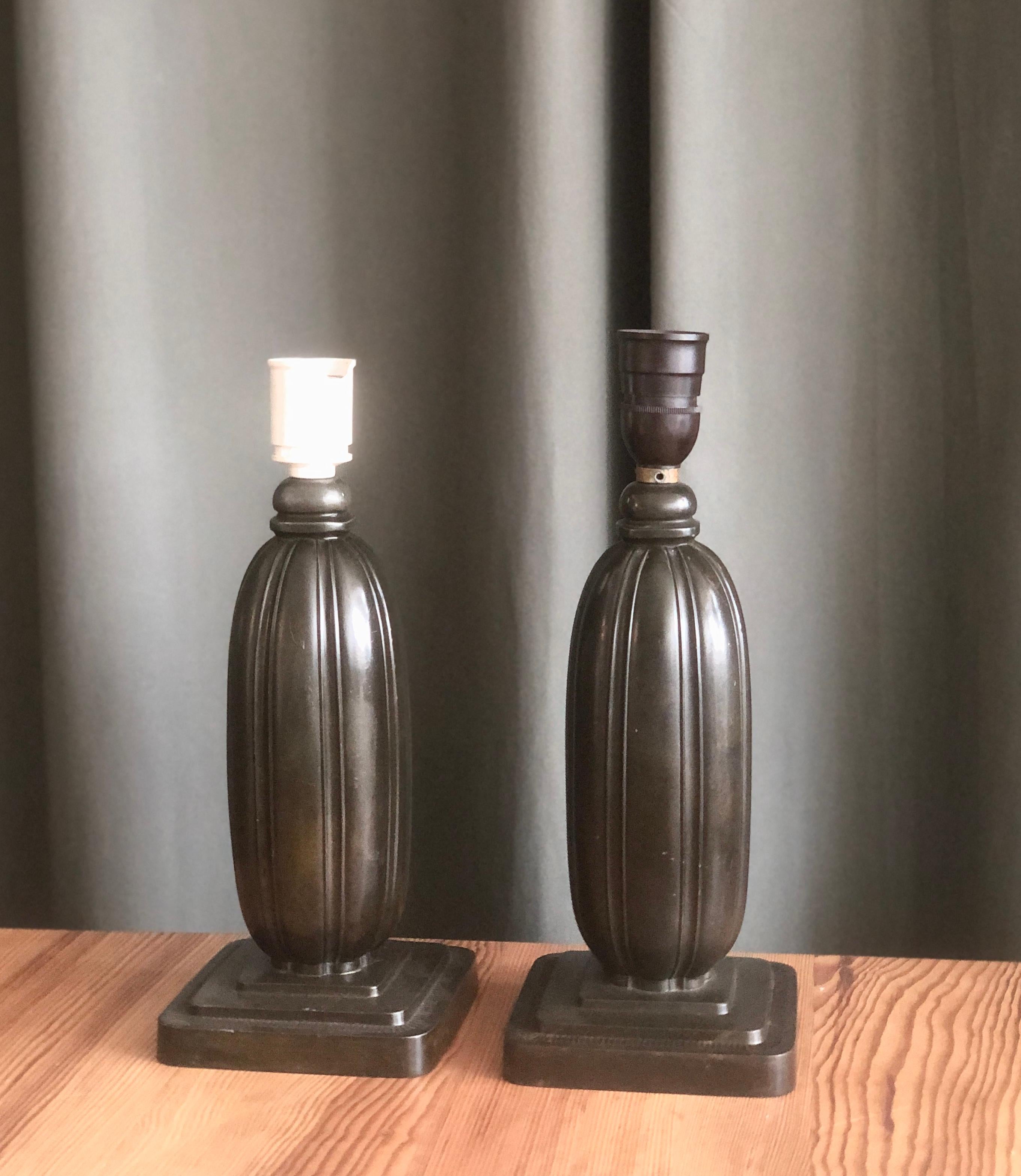 A pair of patinated disco metal table lamps by Just Andersen, Denmark, Circa 1930th. Model 1359. Marked by manufacturer. Rewiring available upon request.
The metal base excluded socket H 13