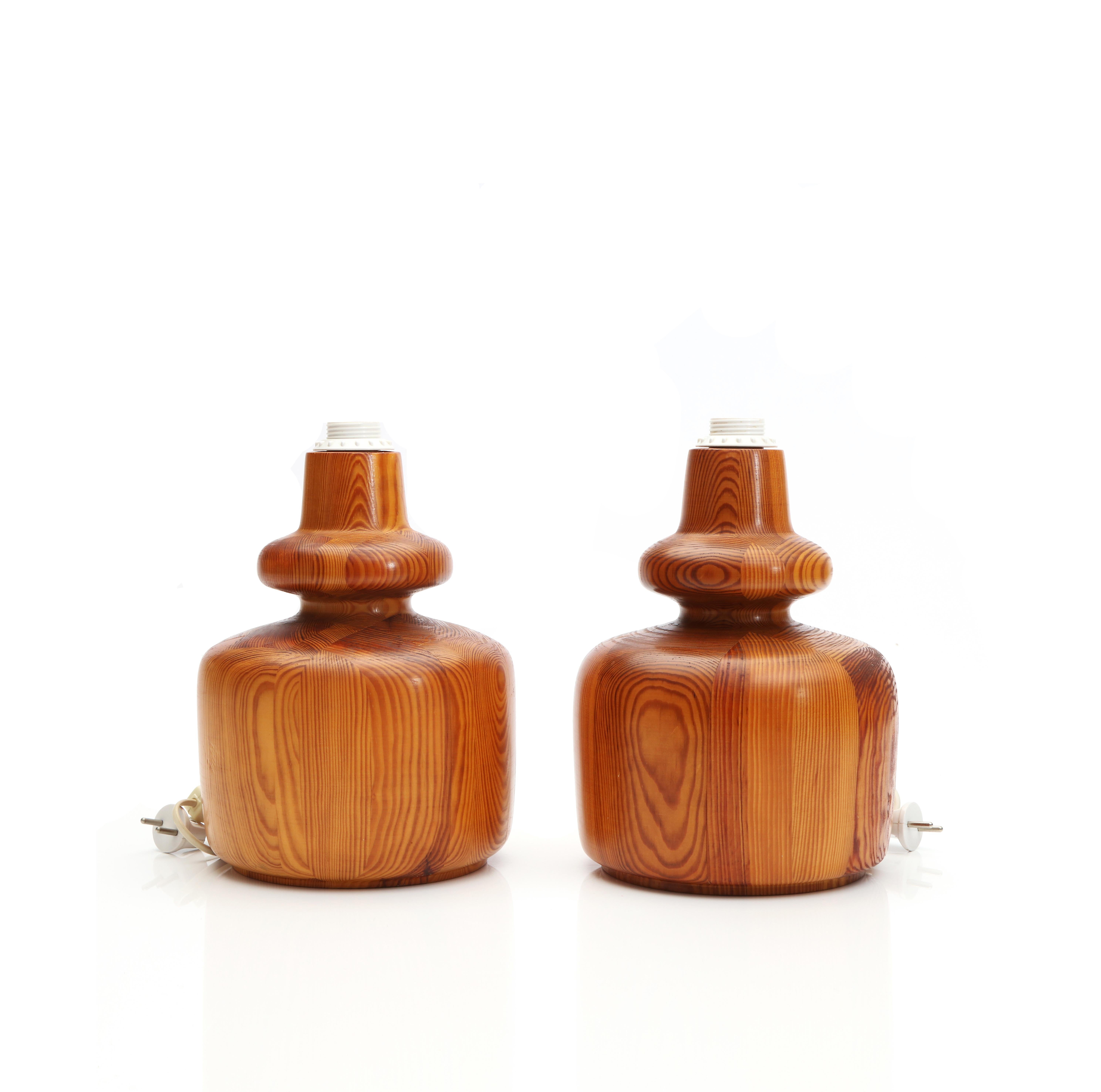 A Pair of designed table lamps in solid pine made in Denmark, 1970s.
Illuminate Your Space with Timeless Craftsmanship 
Indulge in the warmth of tradition and the glow of exquisite craftsmanship with our Danish Pine Table Lamps, handcrafted by a