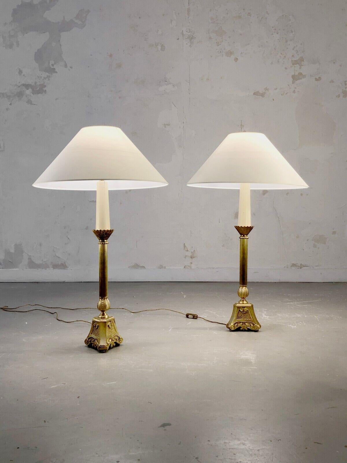 A spectacular and luxurious pair of large table lamps, Neo-classical, Baroque, Empire, with beautiful base in golden bronze, decorated with refined motives. The bases are actually authentic 19th century candlesticks turned into lamps. To be