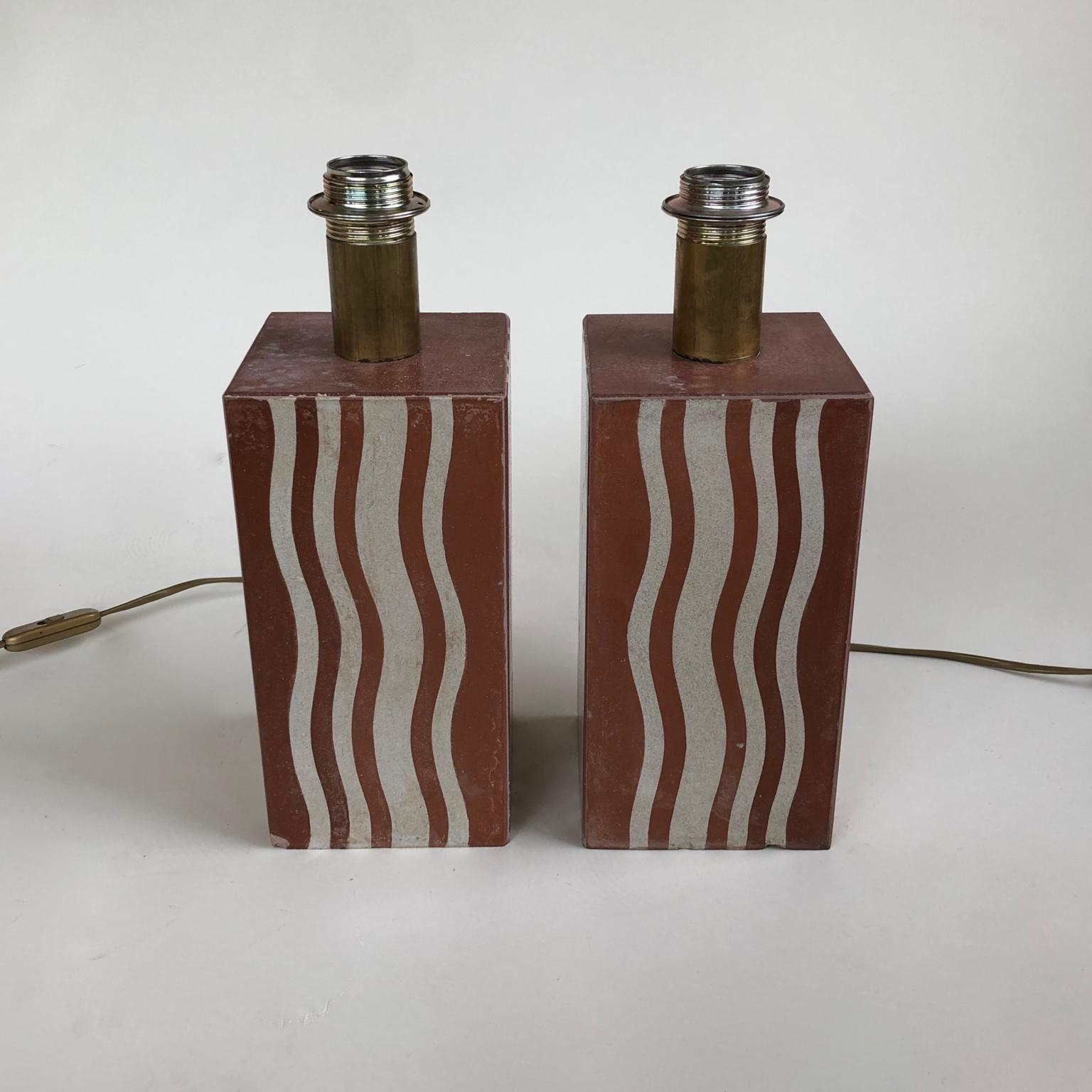 Sold as a pair - 2 desk / table lamps finished with interesting 1930s Reclaimed Art Deco terracotta panels or tiles. These original earthenware tiles or panels are quite unusual with a streamlined Postmodern looking design mixed with lovely earthy