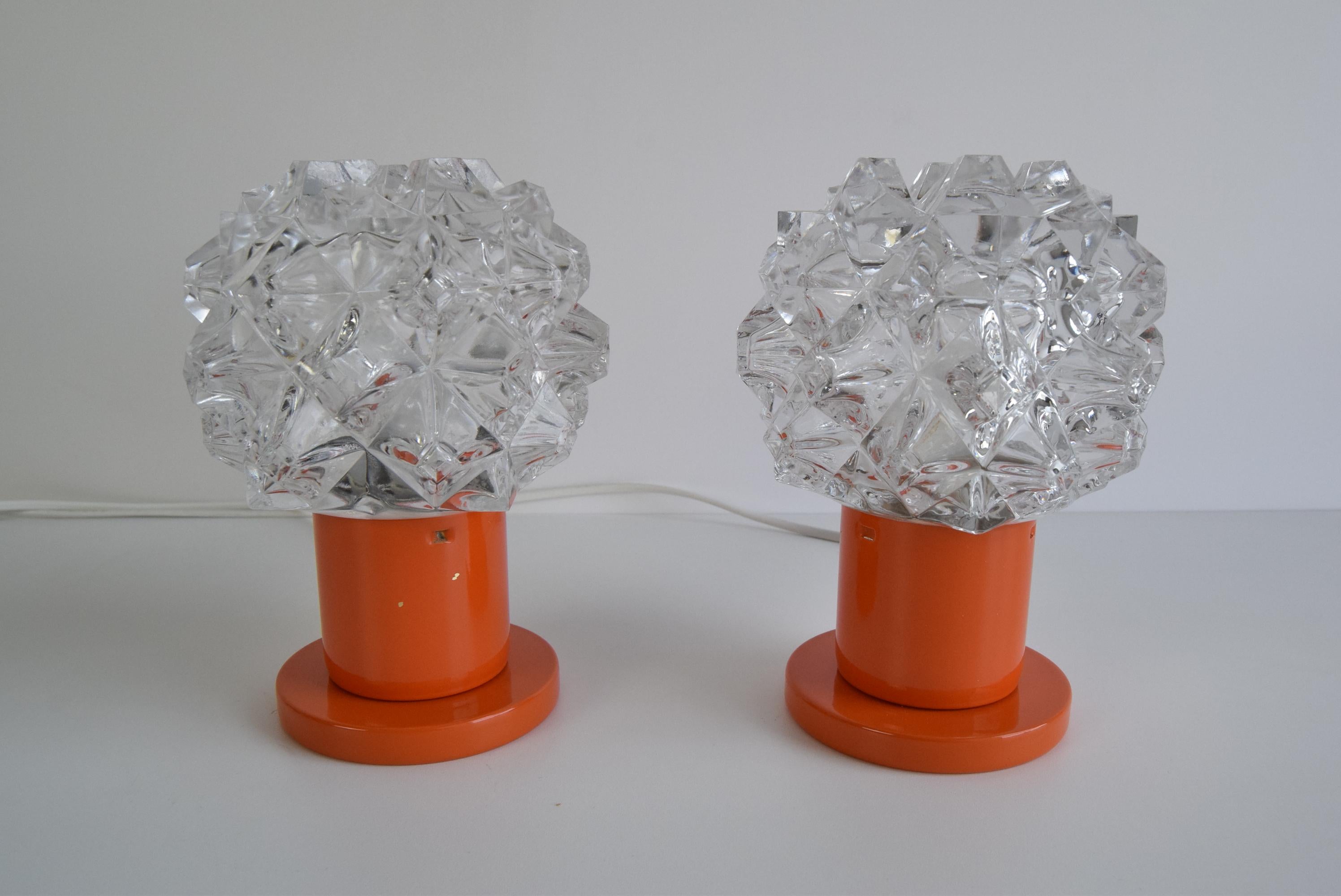 
Beautiful lamps made in the 70s in the Kamenický Šenov glassworks
The combination of clear glass and metal base in the original orange paintwork will enliven any interior.
The lamps have been disassembled and cleaned and polished. They have a new