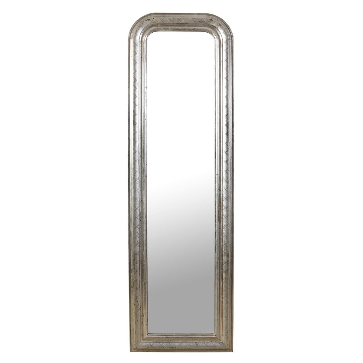 A graceful pair of antique French mirrors (Louis Philippe) with beautifully aged frames that reflect timeless elegance and craftsmanship. Their tall, refined proportions make them ideal for flanking a console, brightening a hallway, or adding height