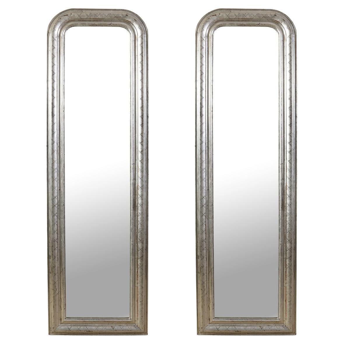 A Pair of Tall Antique Silvered Mirrors For Sale