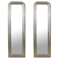 A Pair of Tall Antique Silvered Mirrors