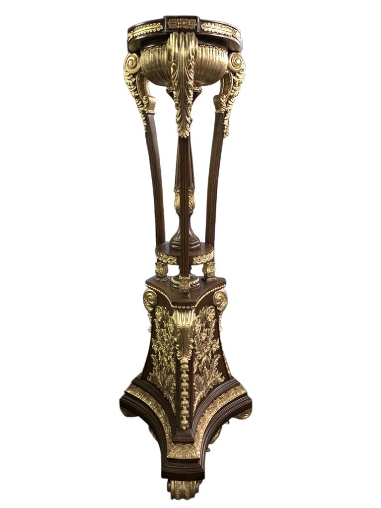 A Stunning pair of large French Empire style pedestal stand torcheres - stand in at over six feet tall so great size to this pair. Hand carved from mahogany and finished in gilt on the accent pieces. Very high end interiors driven pair. Top features
