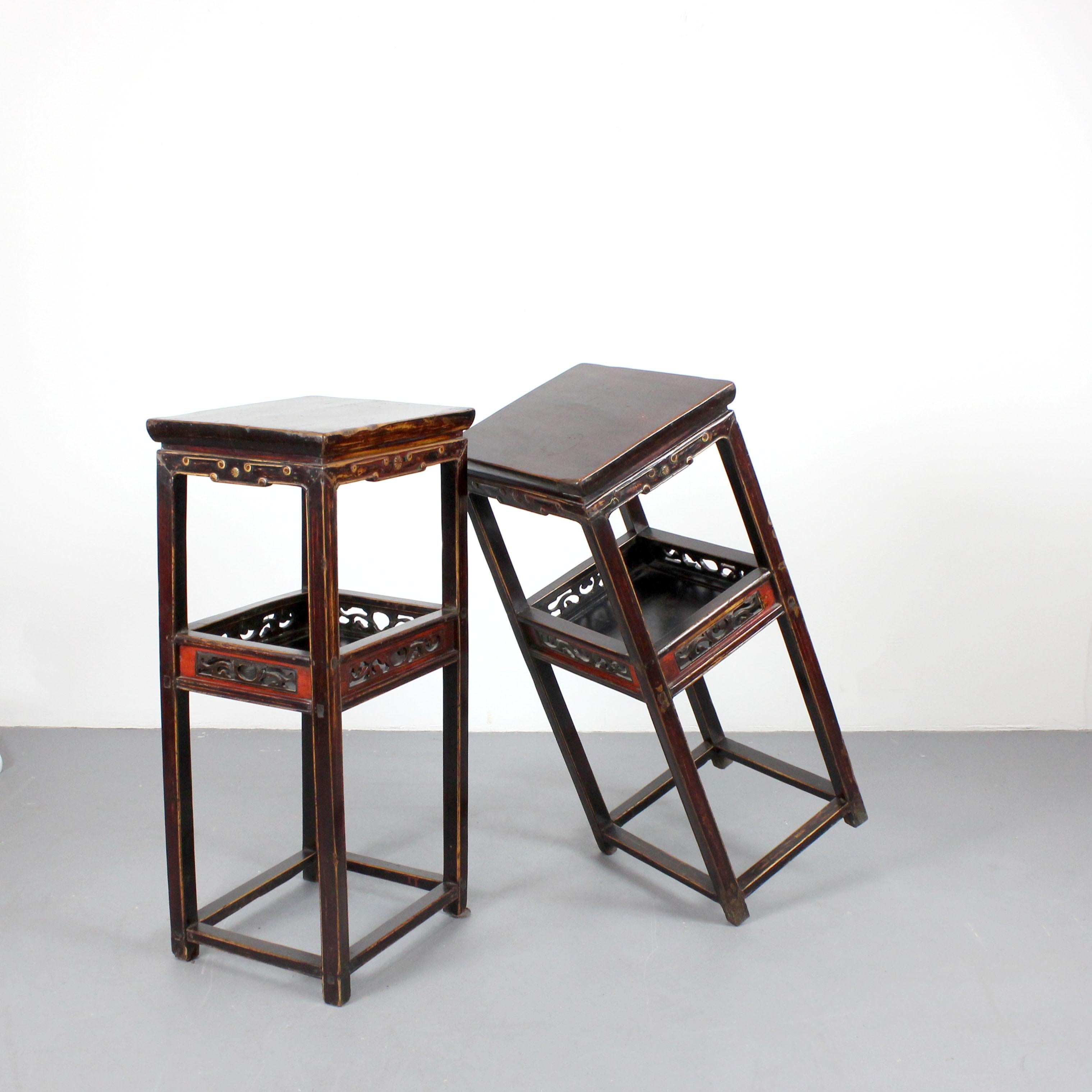 Chinese A pair of tall tables, stools, or pedestals crafted from carved and polychromed For Sale