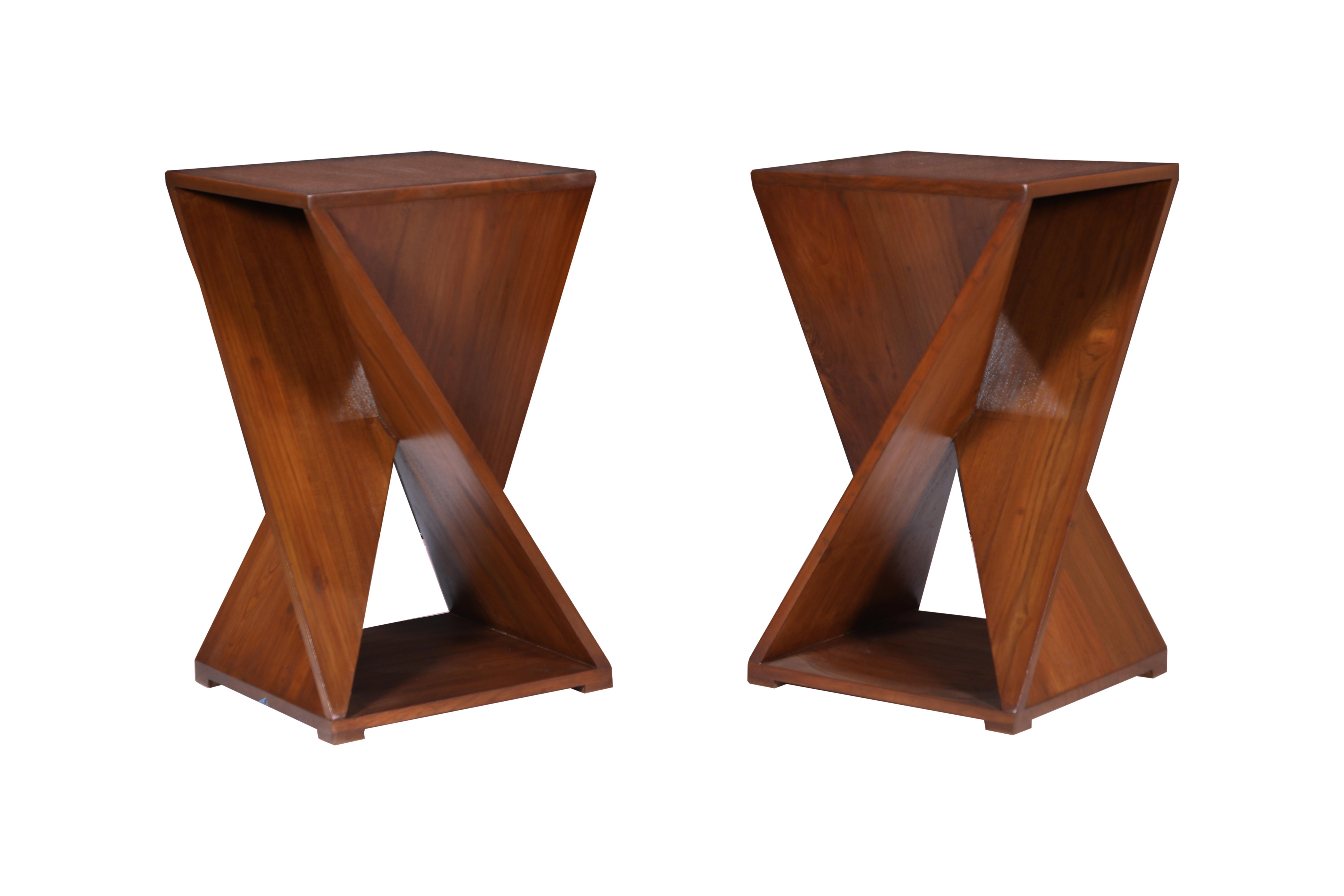 A fabulous pair of intricately designed side or end tables with multiple angles taking on an architectural aesthetic. Made in solid teak. Designed by Deborah Lockhart Phillips. Modern.