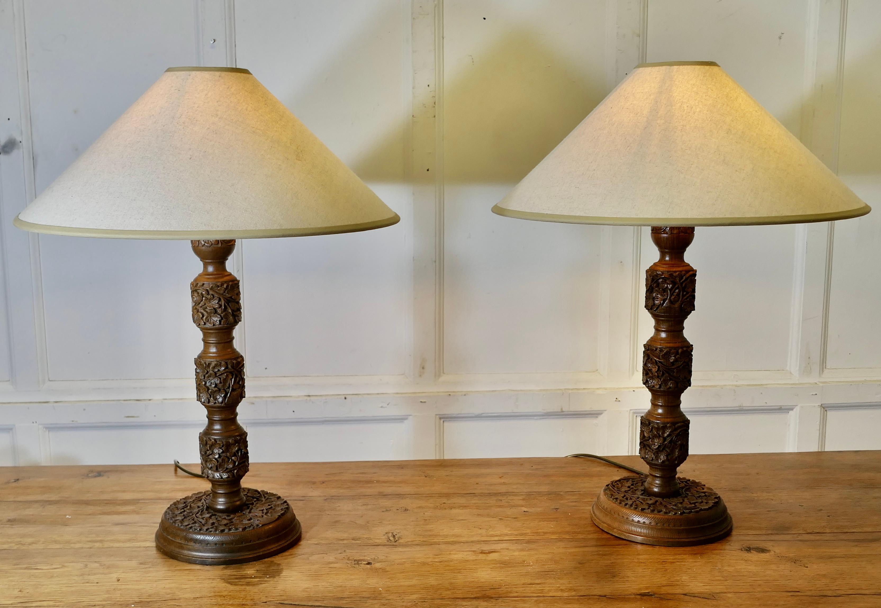 Belle Époque A Pair of Teak Carved Tree of Life Table Lamps   A superb pair of large lamps For Sale