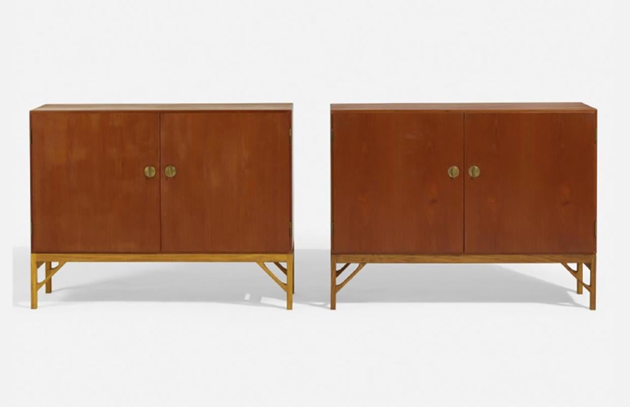 Borge Mogensen designed by Fredericia, Denmark, circa 1940. Both cabinets marked 'FDB 232'.
teak, oak, brass. Both cabinet feature slide out shelves and 4 keys double as door pulls.