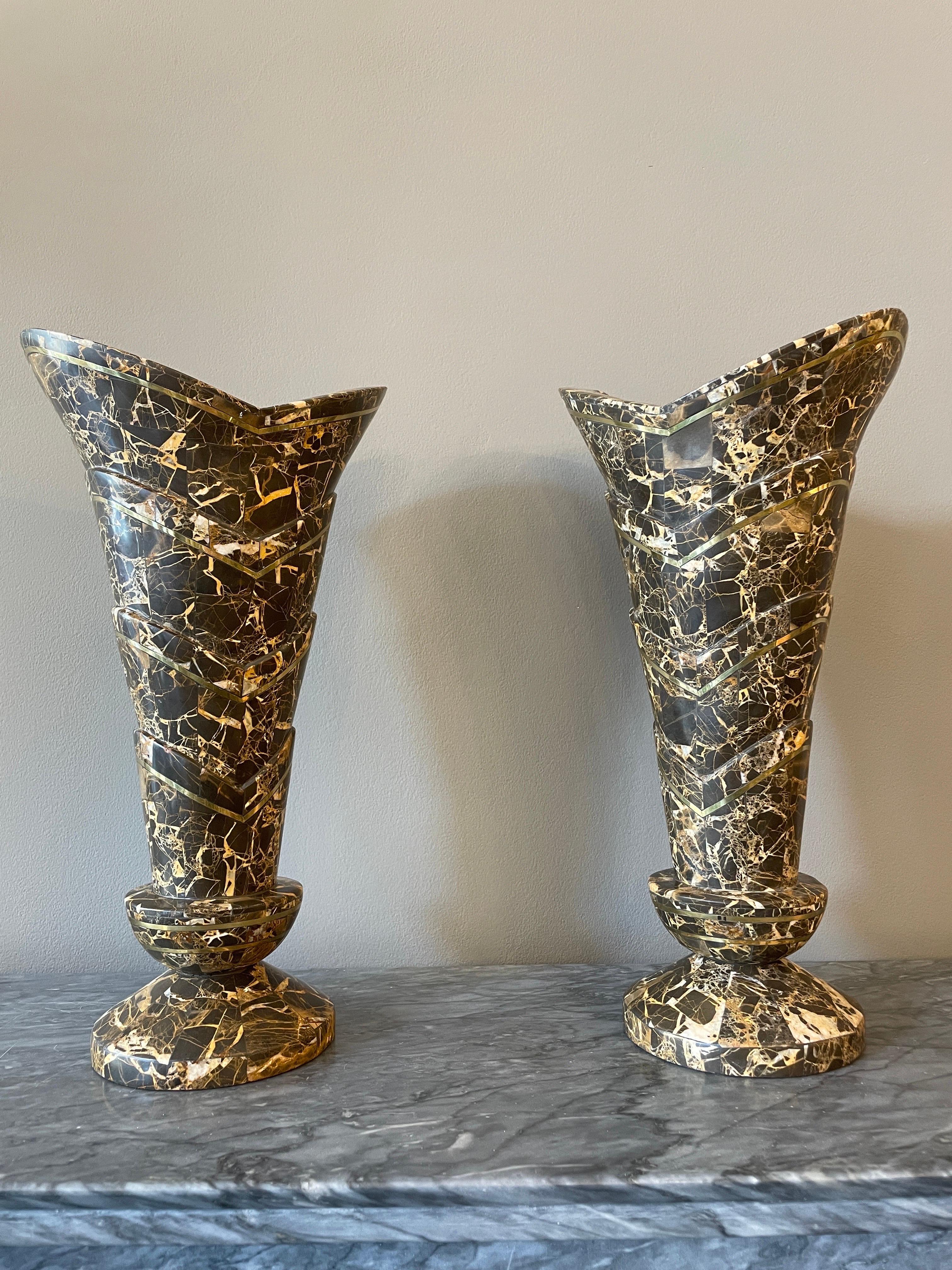A pair of tessellated marble with brass inlay vases by Maitland Smith. 
A very elegant and stylised pair with stepped design with brass banded inlay. 
Good size and scale. In Portoro black and gold marble. Images a true reflection of condition and
