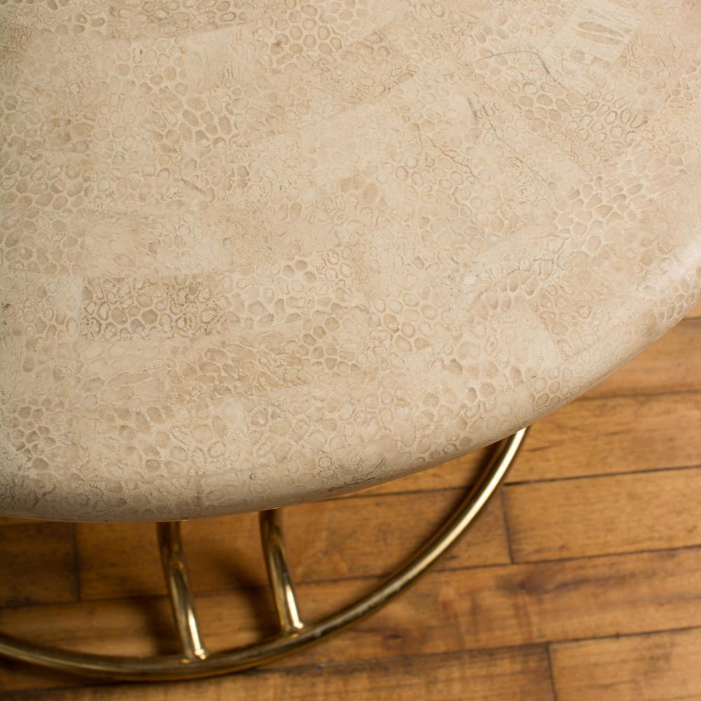 A pair of tessellated stone round side tables by Maitland Smith with brass bases, C 1970.
  