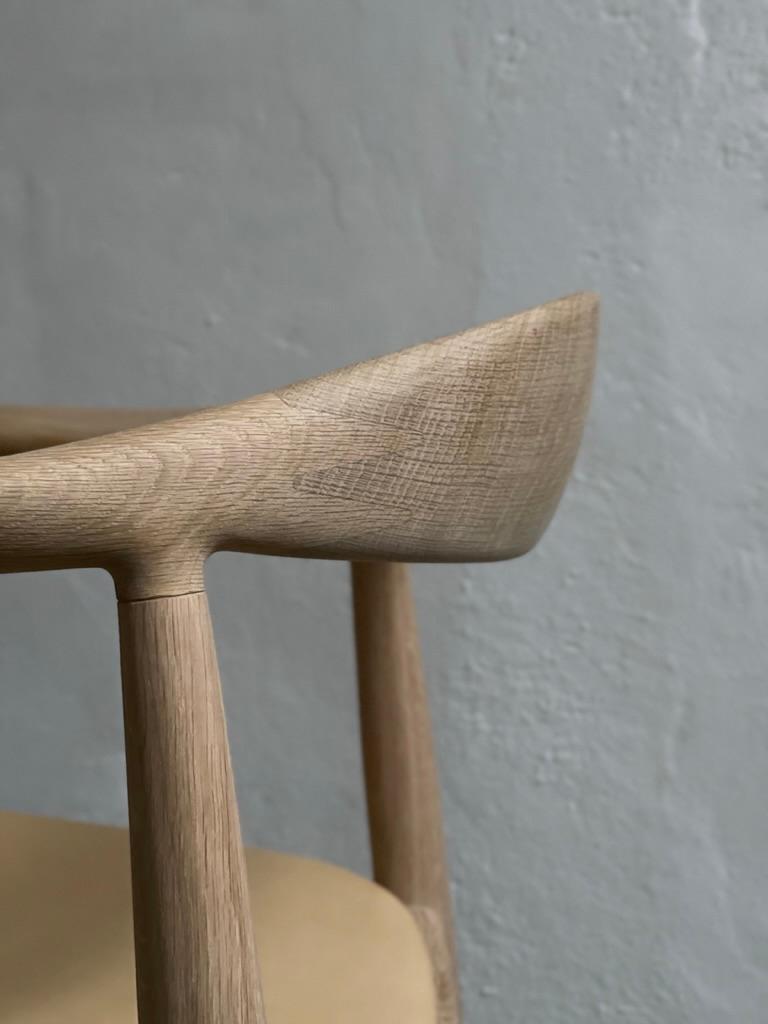 A pair of 'The Chair' by Hans J Wegner (1949) in soap treated oak and leather. 4