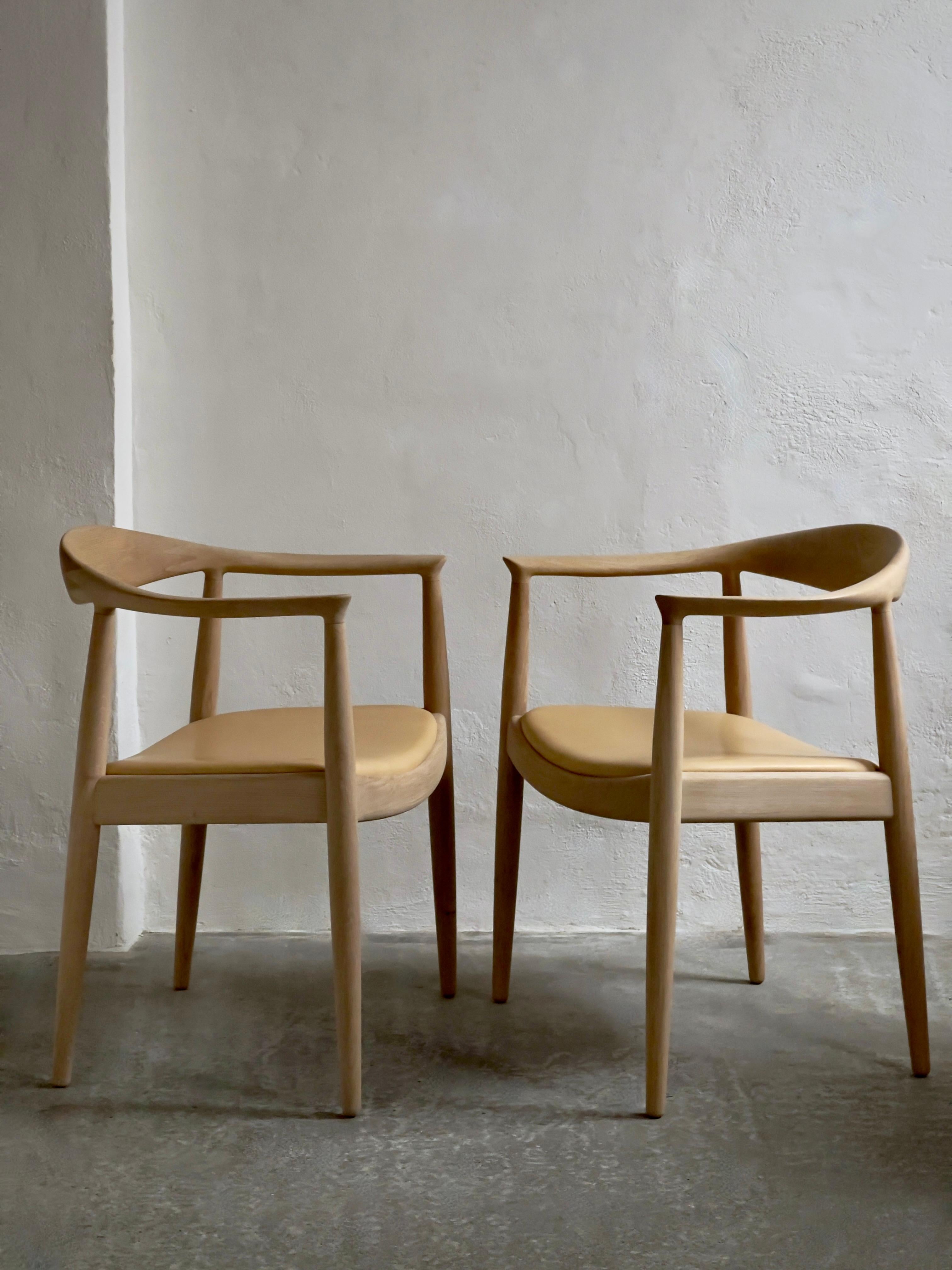 A pair of 'The Chair' by Hans J Wegner (1949) in soap treated oak and leather. 6