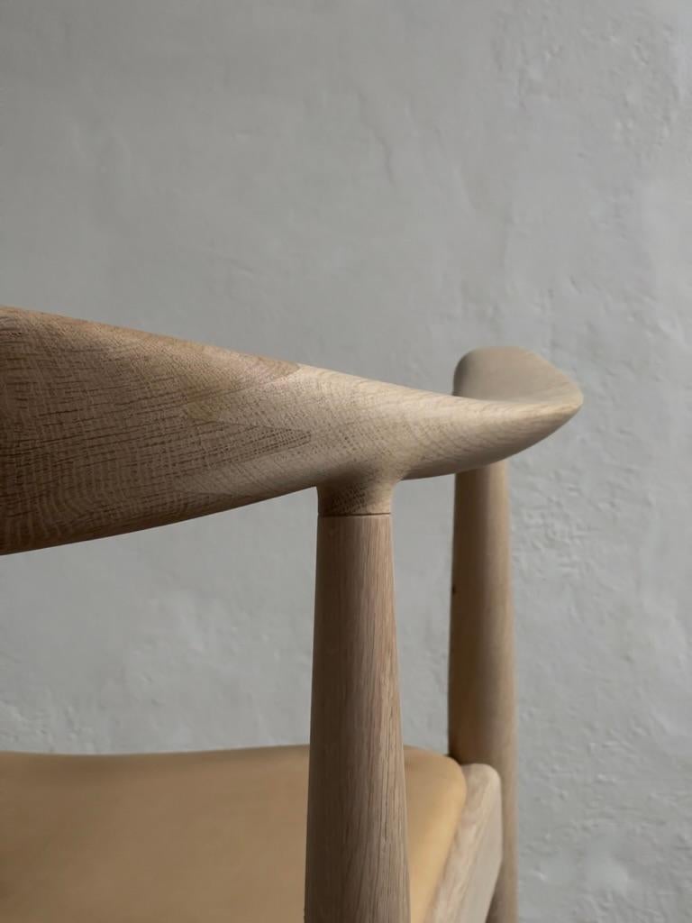 Contemporary A pair of 'The Chair' by Hans J Wegner (1949) in soap treated oak and leather.
