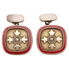 Ein Paar Manschettenknöpfe des "Order of the British Empire" aus vergoldetem Silber und roter Emaille 