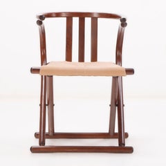A pair of Thonet style folding sling chairs having downswept arms