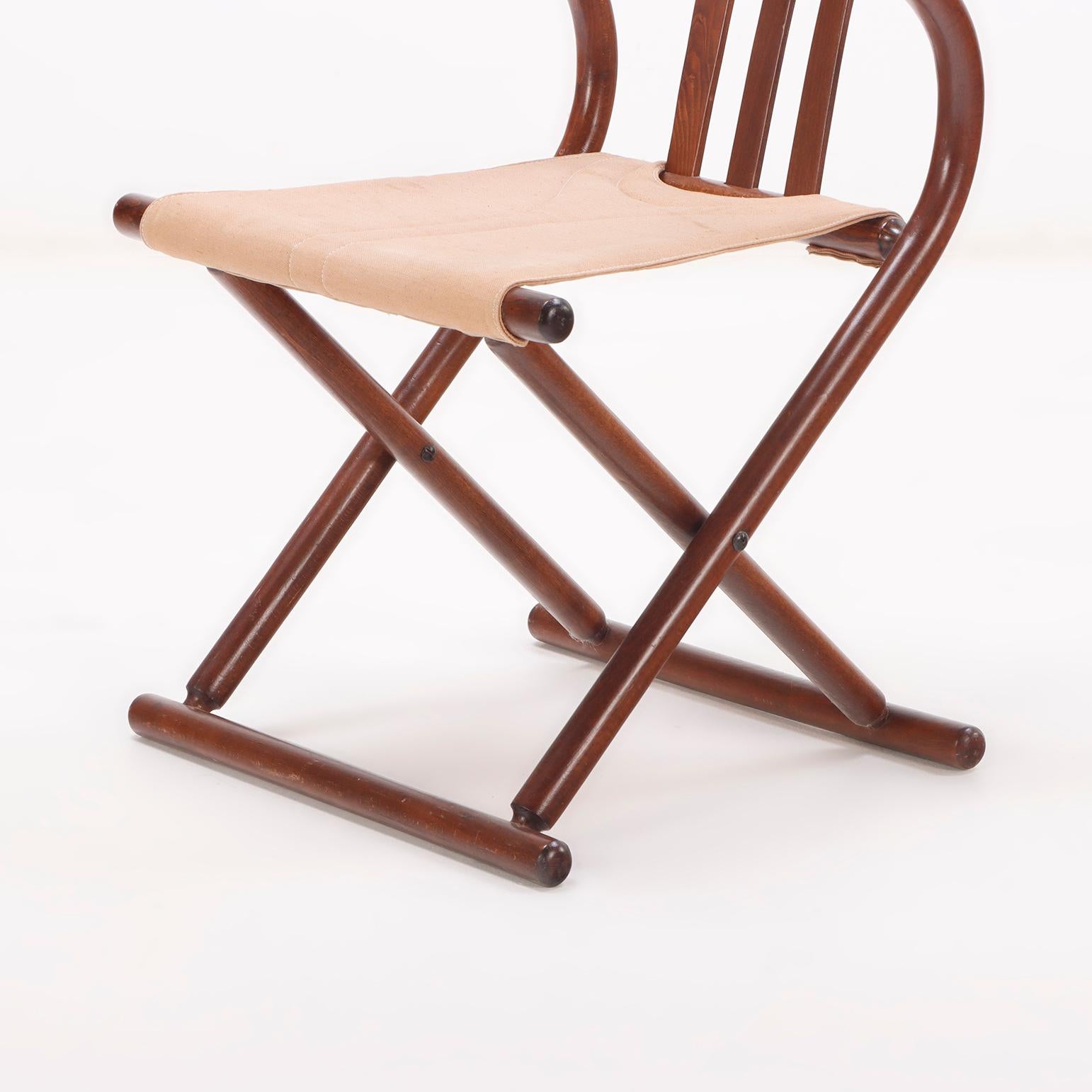 European A pair of Thonet style folding sling chairs having downswept arms For Sale