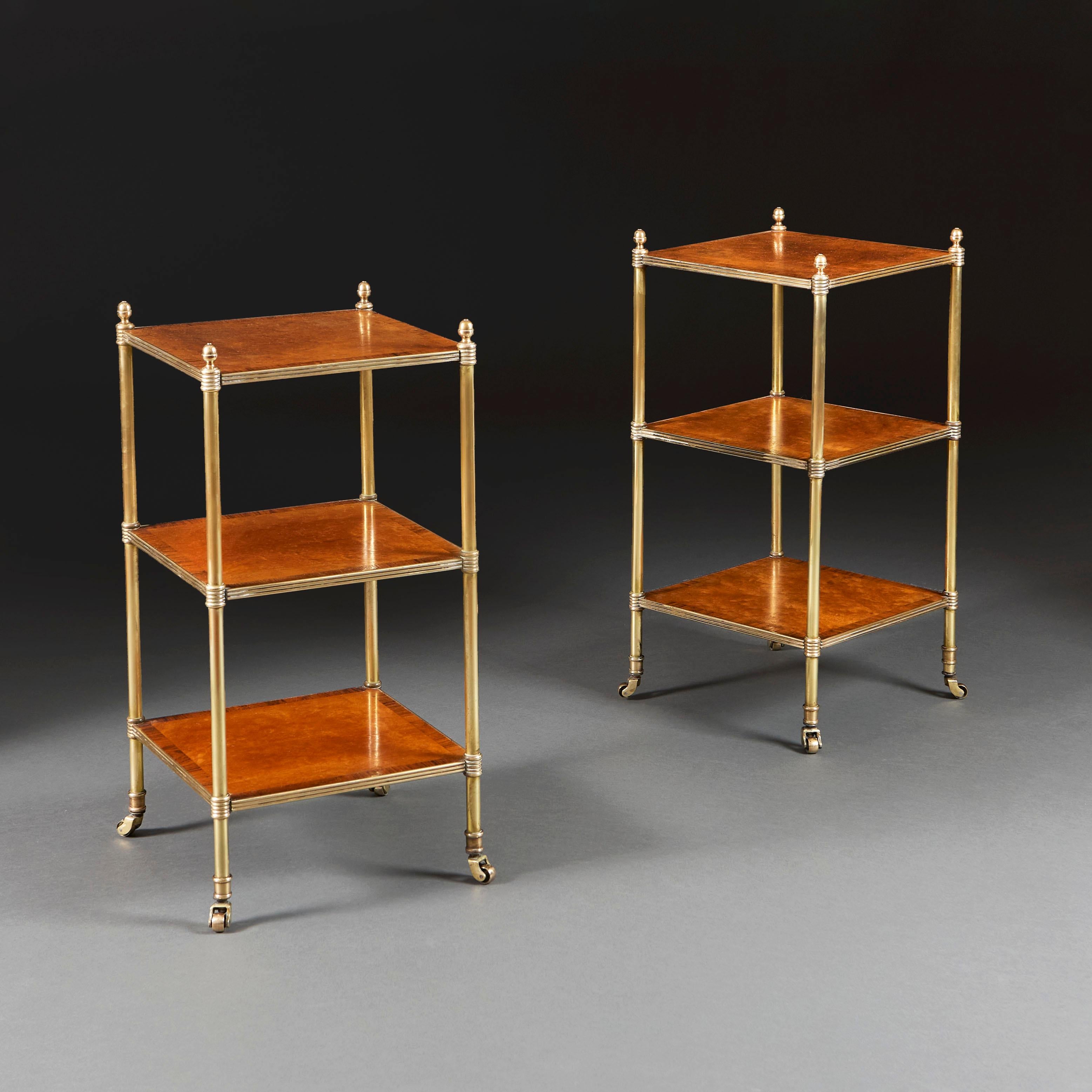 England, circa 1900

A pair of Edwardian three tier etageres, the satinwood surfaces with crossbanded borders, with brass uprights surmounted by acorn finials, and terminating in brass castors.

Height 66.00cm
Width 31.00cm
Depth 31.00cm
