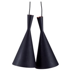 A pair of Tom Dixon, Beat Light Tall pendants, crafted in hammered metal.