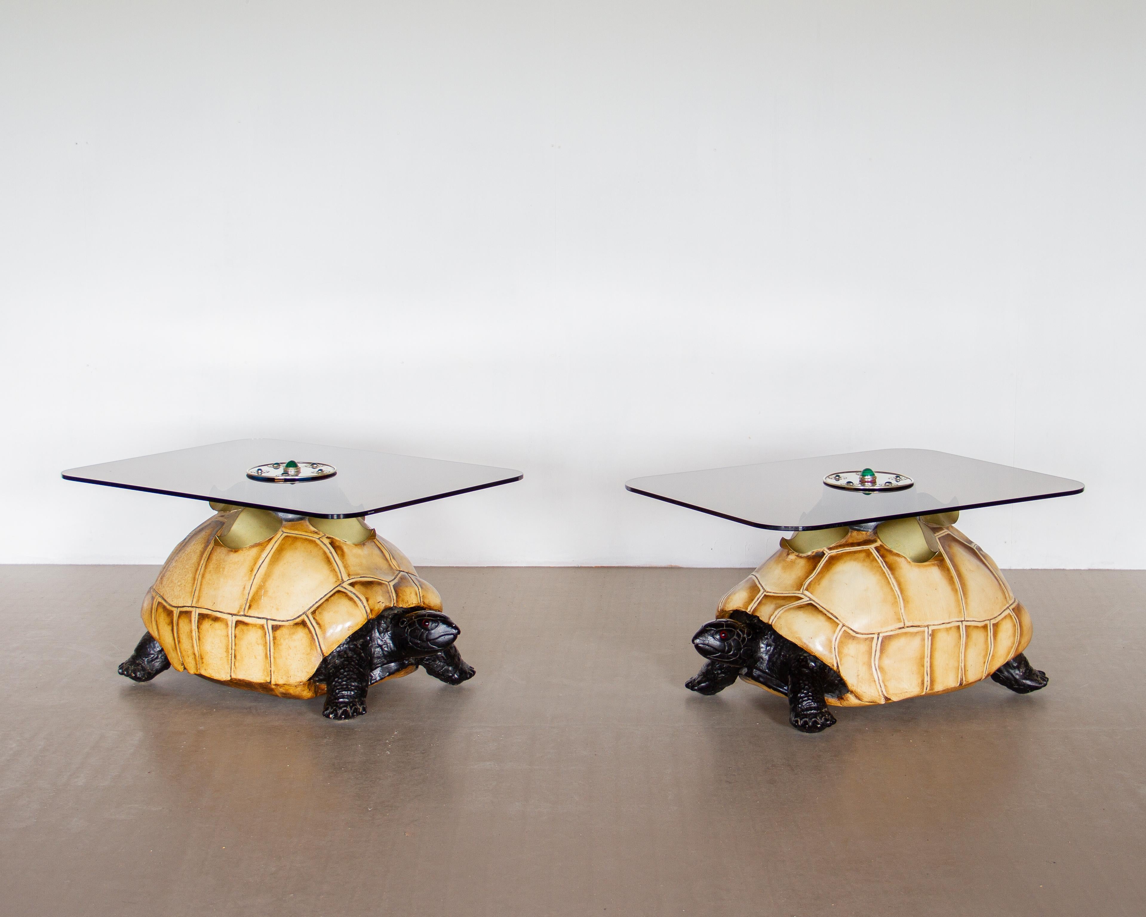 A Pair of tole painted Tortoise coffee tables by Anthony Redmile, in excellent original condition, each stamped Redmile, London with smoked glass tops surmounted by brass, malachite and green glass cabochons.