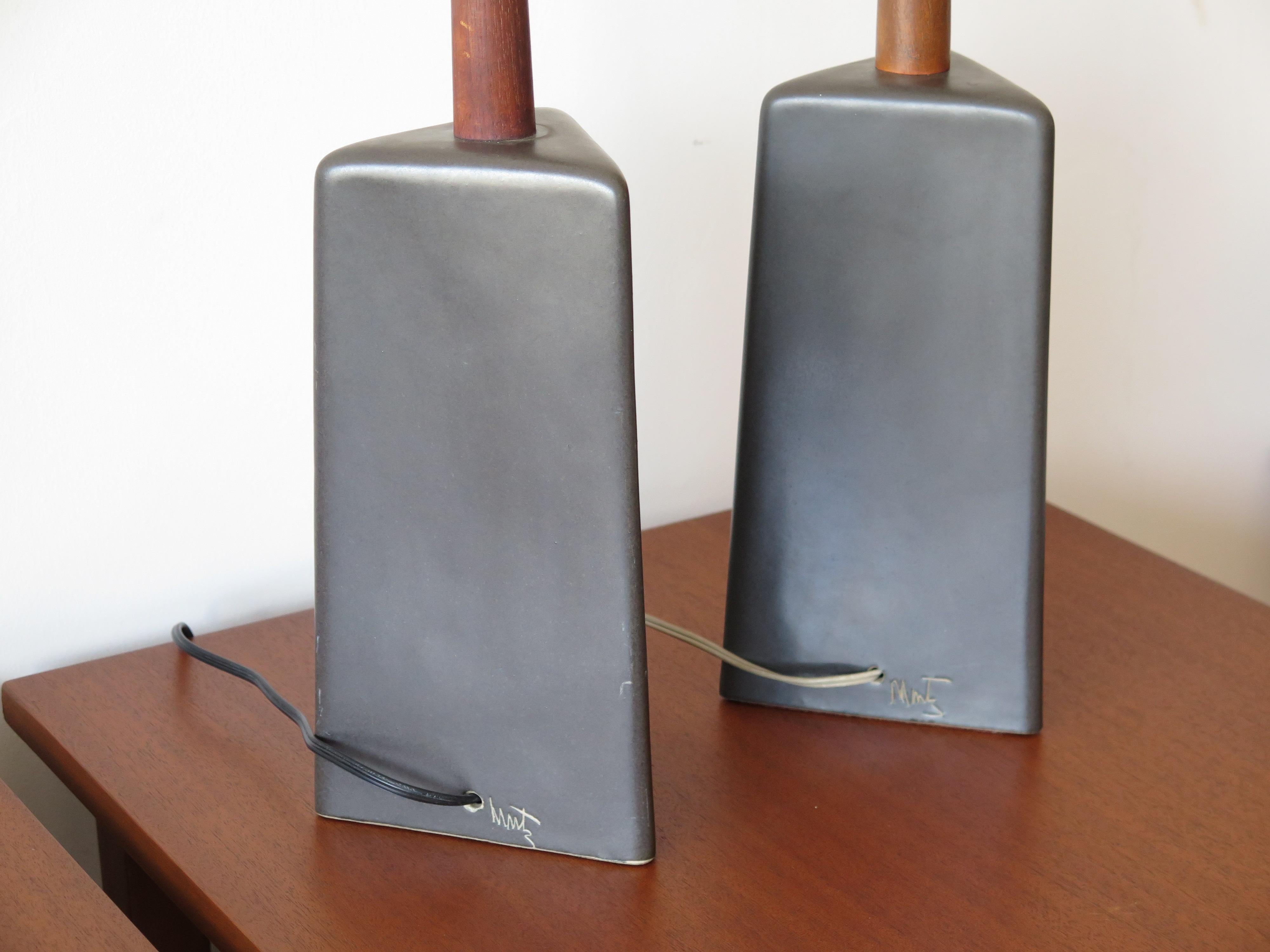 A pair of unusual triangular shaped lamps by Gordon and Jane Martz for Marshall Studios, ca' 1960's. Model #237 in matt black, closer to dark gray brown color. Both lamps signed. Total height with shades approx.24