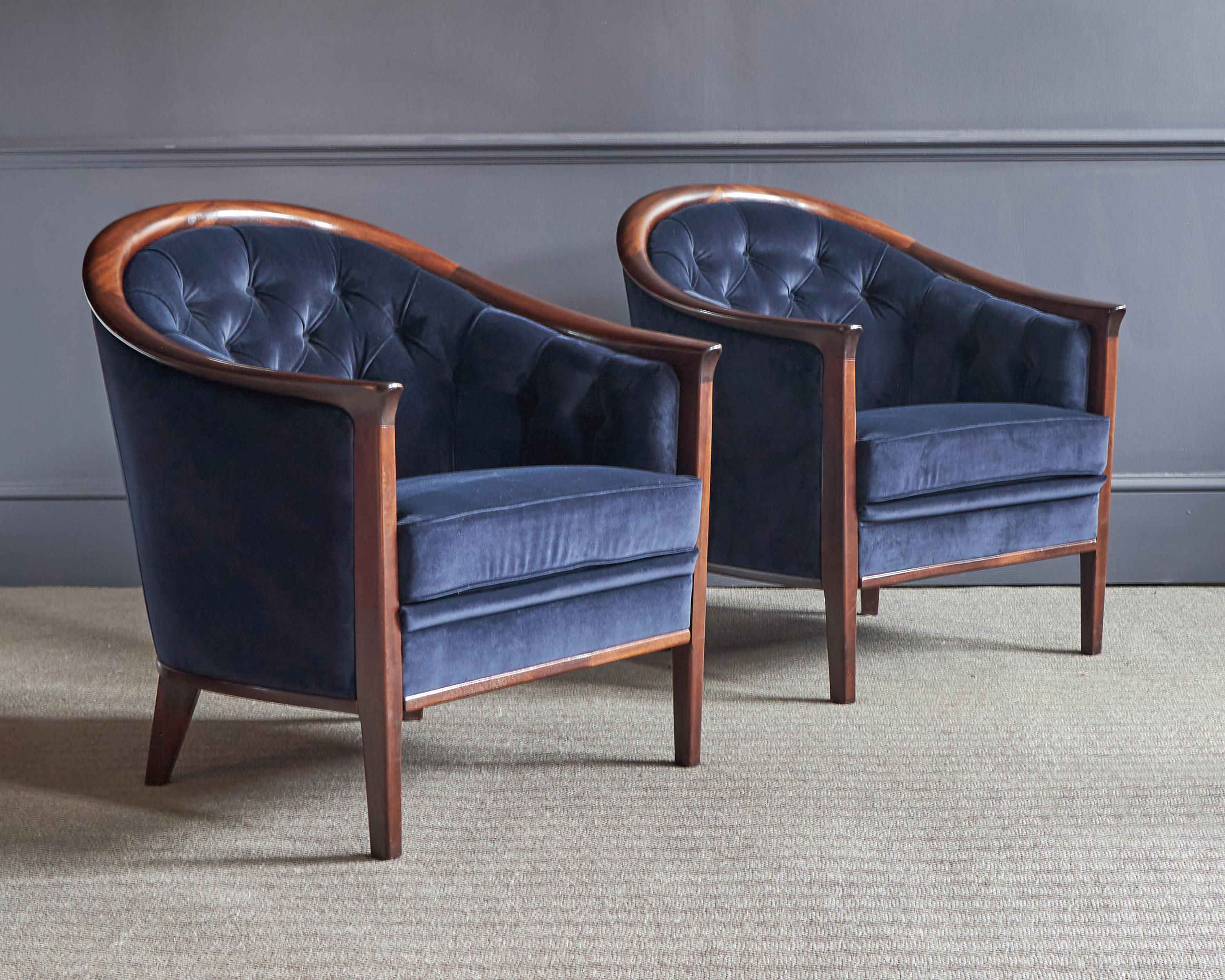 An absolutely stunning pair of vintage Swedish armchairs in Walnut. They were designed by Bertil Fridhagen in the 1960’s.

The quality is outstanding, the solid walnut frames have beautiful, sweeping curves. They are well sprung and very
