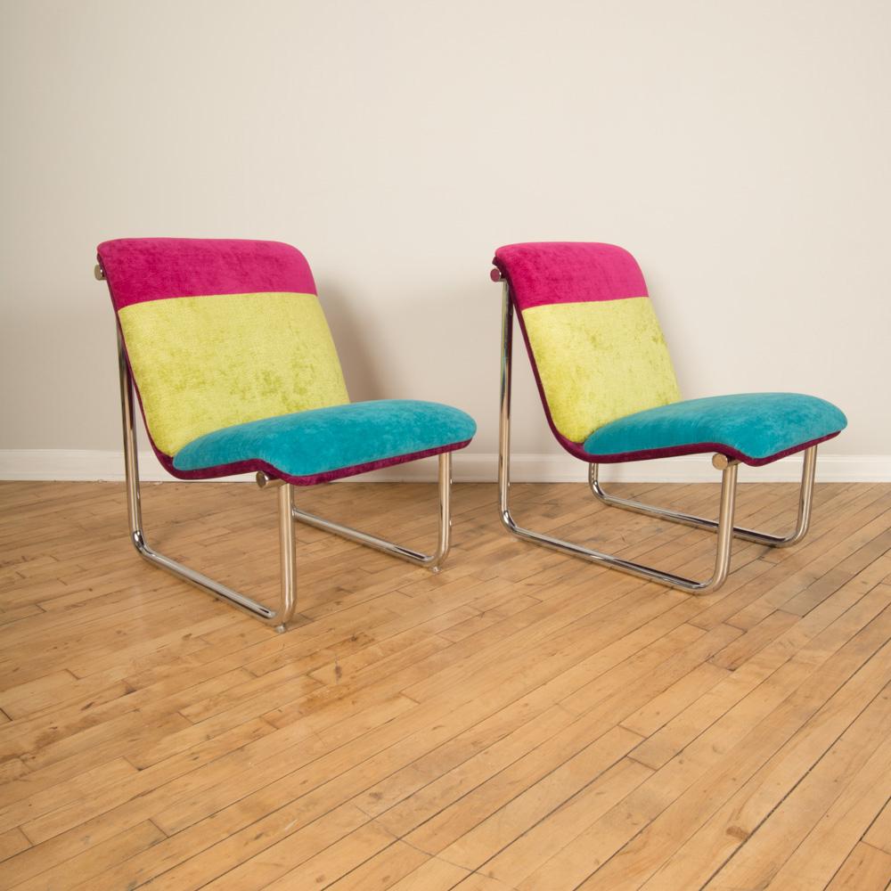 A pair of tubular chrome lounge chairs. Circa 1970.
 Chairs are covered in 3 Chenille Jewel tone fabrics from Robert Allen.