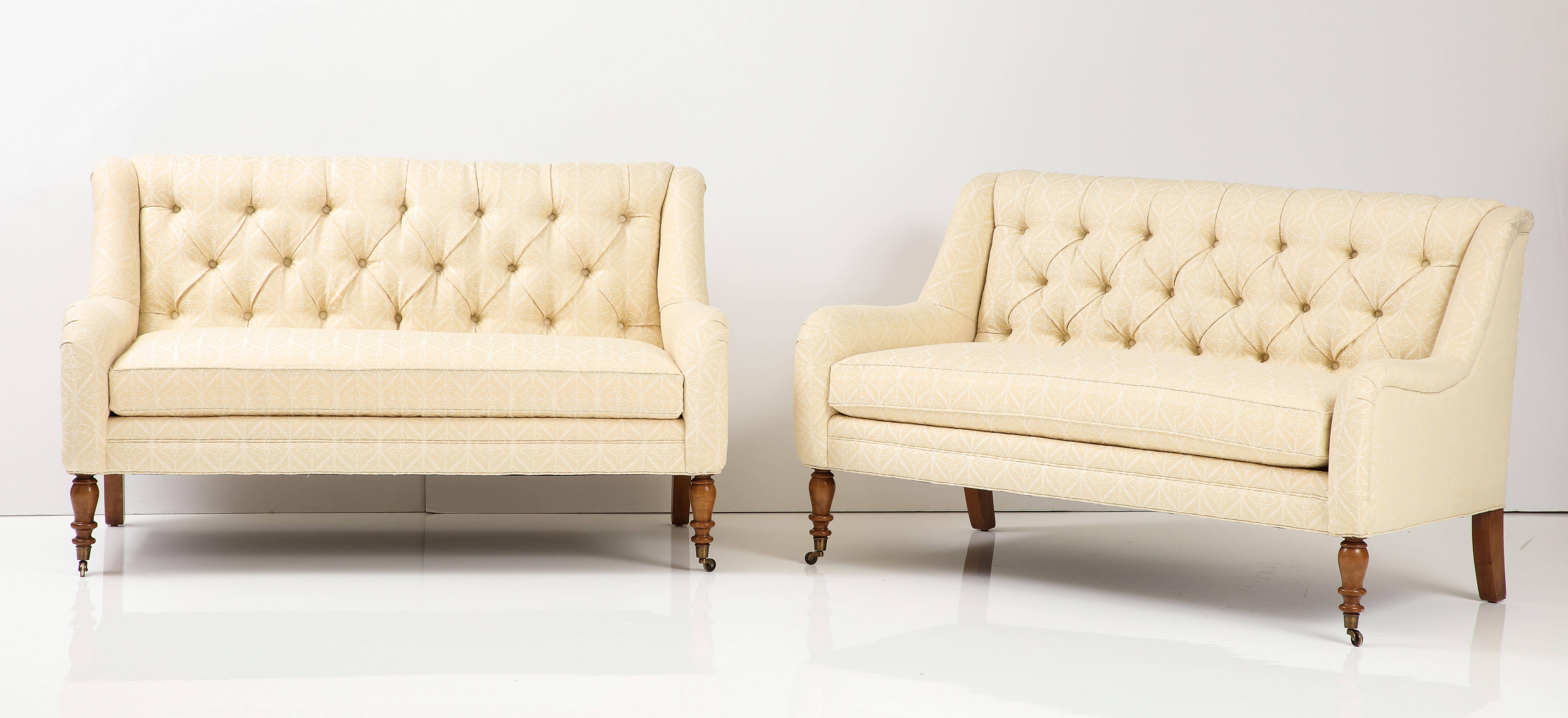 The clean lines of these two love seats make them quite versatile--they would be perfect in an entry, flanking a fireplace or as seating at a dining table. Featuring a tufted back and a loos seat cushion, the loveseats have rounded arms and turned