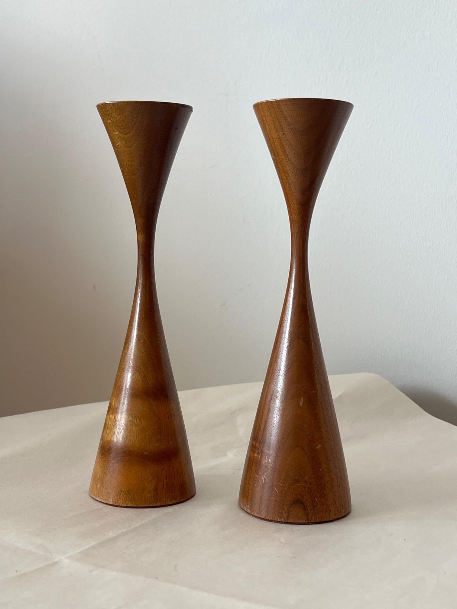 A pair of turned walnut candlesticks by Rude Osolnik, ca' 1970's.

