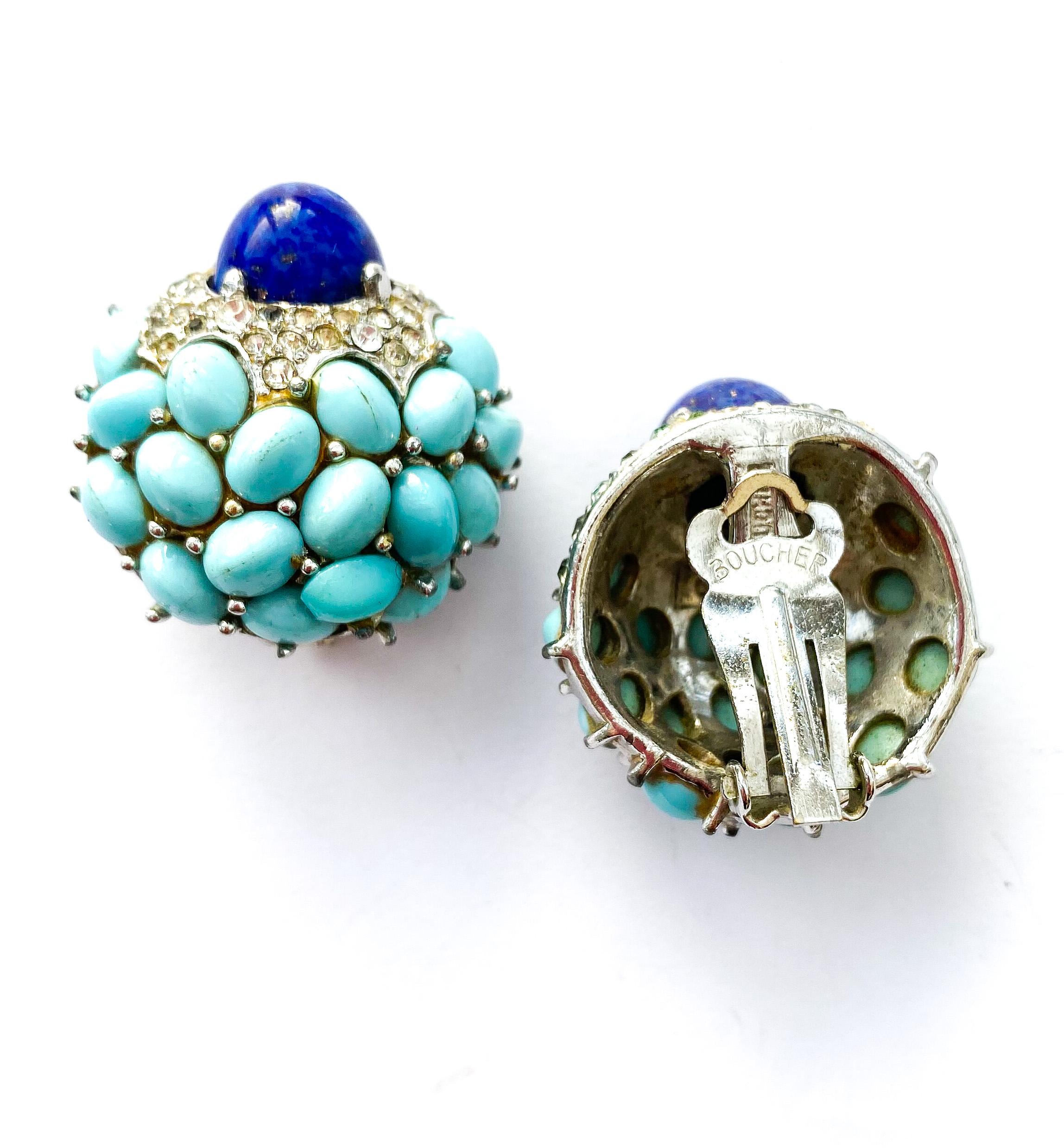A beautiful pair of 'cluster' earrings, with turquoise cabochons, and a large lapis 'bullet' cabochon at the centre of each earring, highlighted all round with clear pastes. Echoing designs from Cartier and Van Cleef And Arpels of the same period,