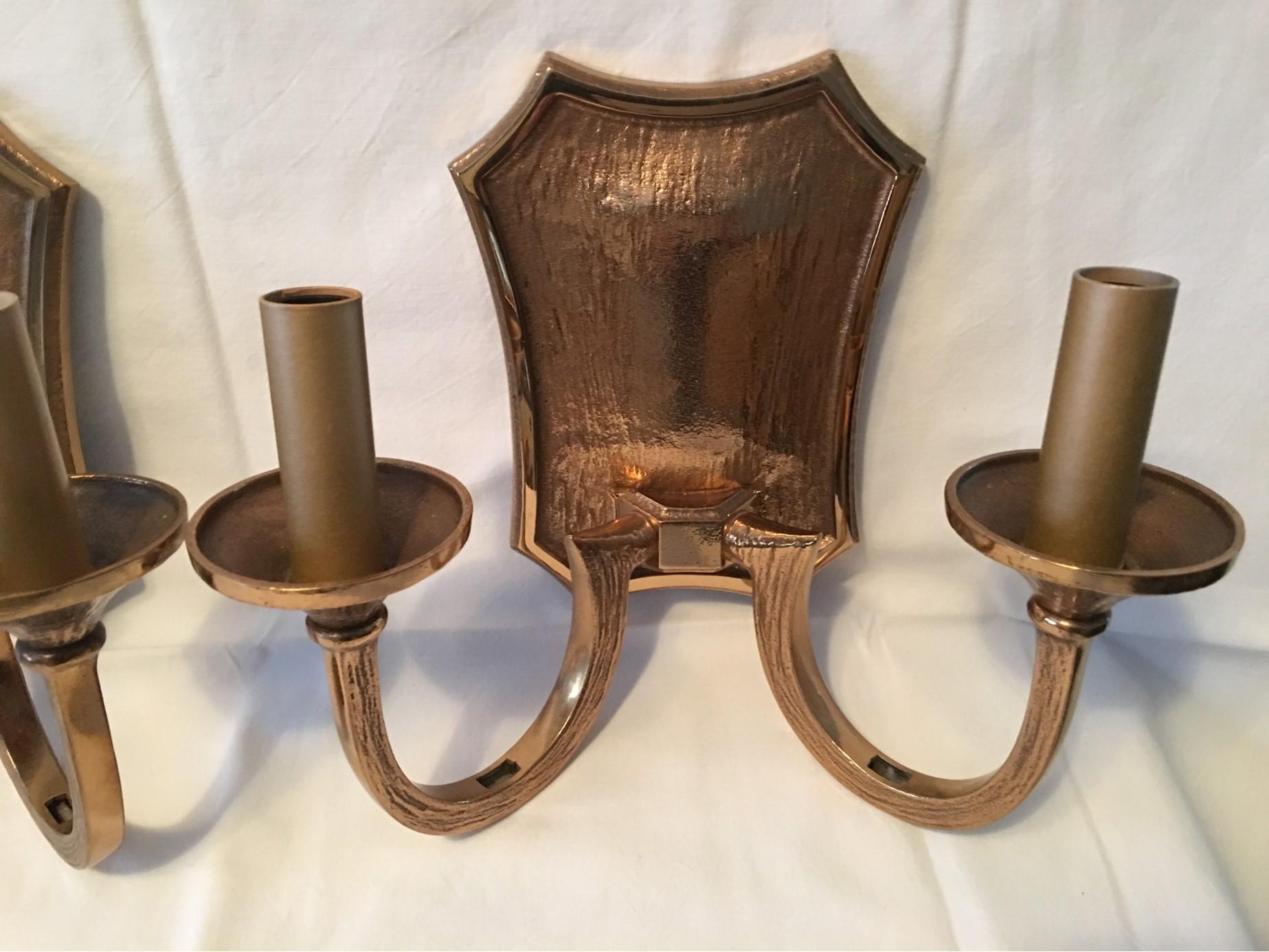 A great pair of two arm, two bulb each Brutalismus style bronze lamps from the 1970s. The massive lamps require two European style E 14 Candelabra bulbs each up to 60 Watts. Will be shipped directly from Germany to Buyer.