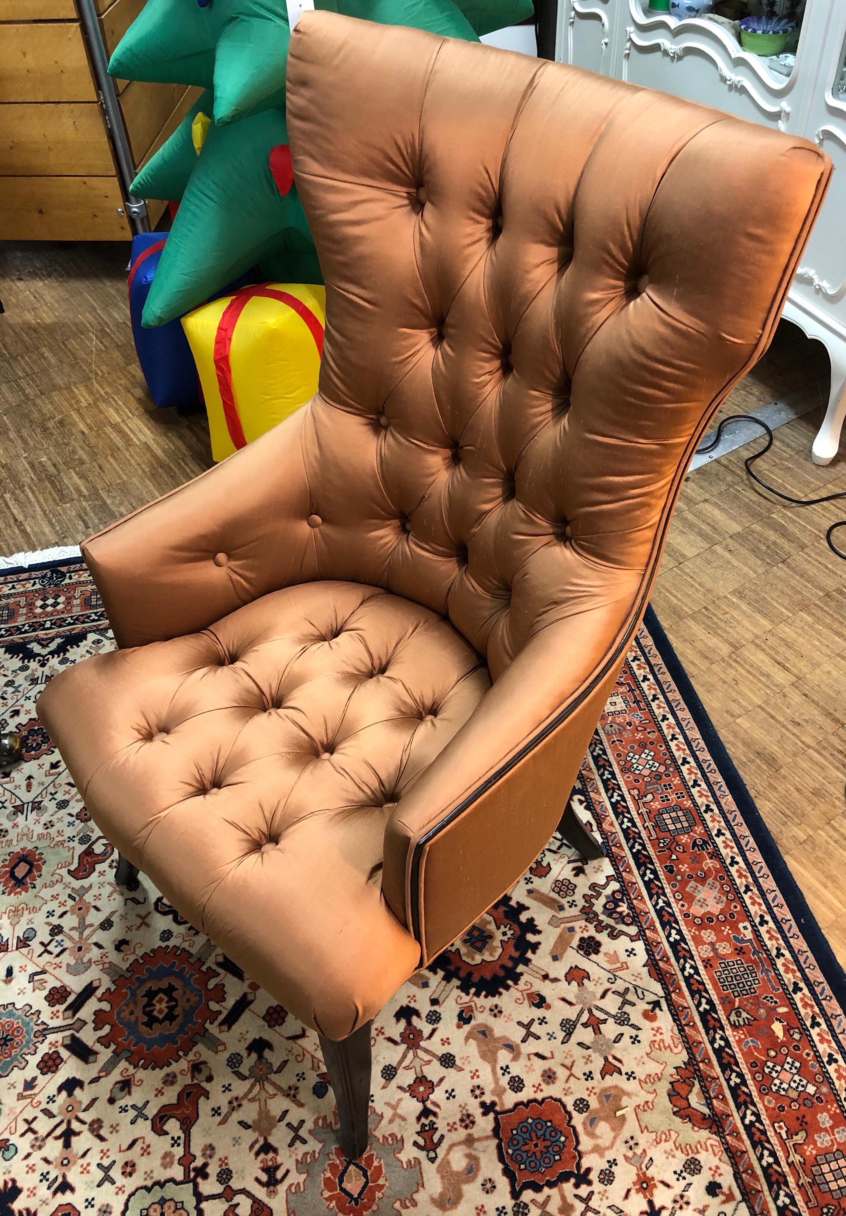 A pair of two lounge satin high back button chairs, excellent condition, new upholstery golden -orange nuance , Mid-Century Modern , made in Switzerland.