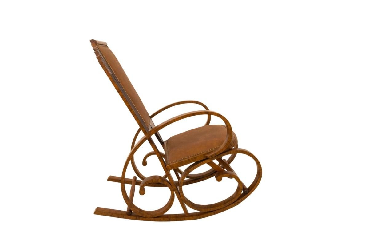 A pair of unique rocking chairs, Poland, second half of the 20th century.

A pair of vintage rocking chairs. Made of walnut wood and upholstered in new brown leather.

A unique pair of chairs, after renovation.

Dimensions:

Height: 105 cm

Width:
